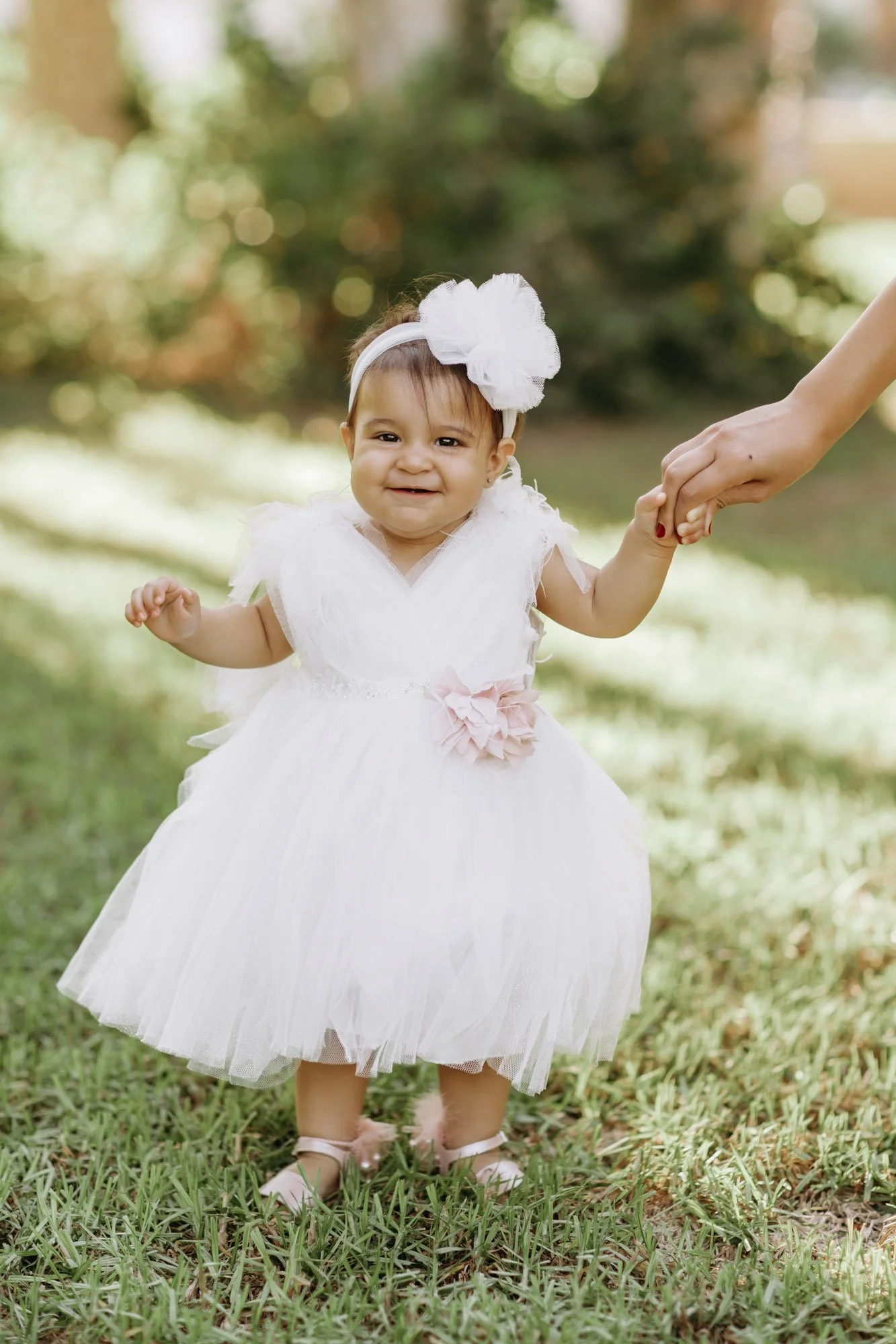 toddler walking on grass Nicosia family photoshoot Cyprus natural park setting