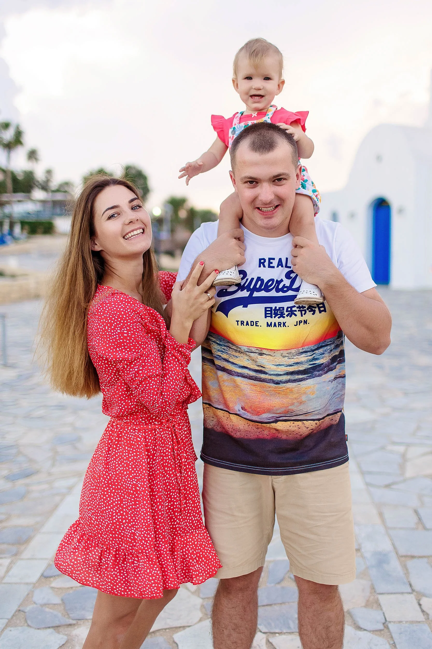 happy family photoshoot Protaras Cyprus parents and child smiling near beach