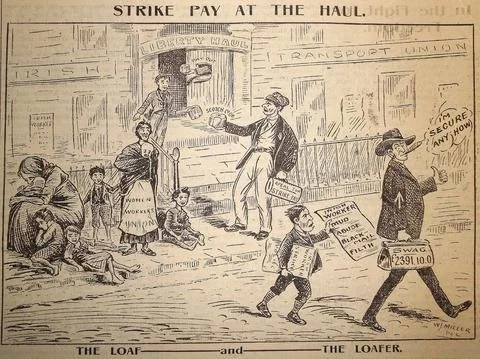 A narrow market street hums with life in early 20th-century Ireland. The cobbled lane is lined with traders and townsfolk, children gathered in small clusters, and tables piled with dark leafy produce. Long bolts of fabric hang from doorways, and a t