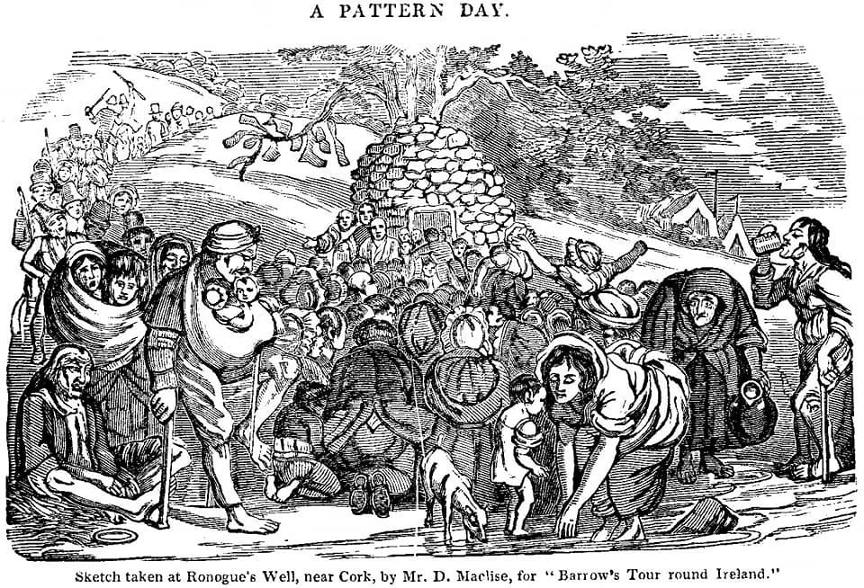 At the base of a stone well, crowds gather in pilgrimage at Ronogue’s Well near Cork, drawn by tradition, faith, and community. This illustration, sketched by Daniel Maclise for Barrow’s Tour Round Ireland, depicts a Pattern Day — a local holy day ce