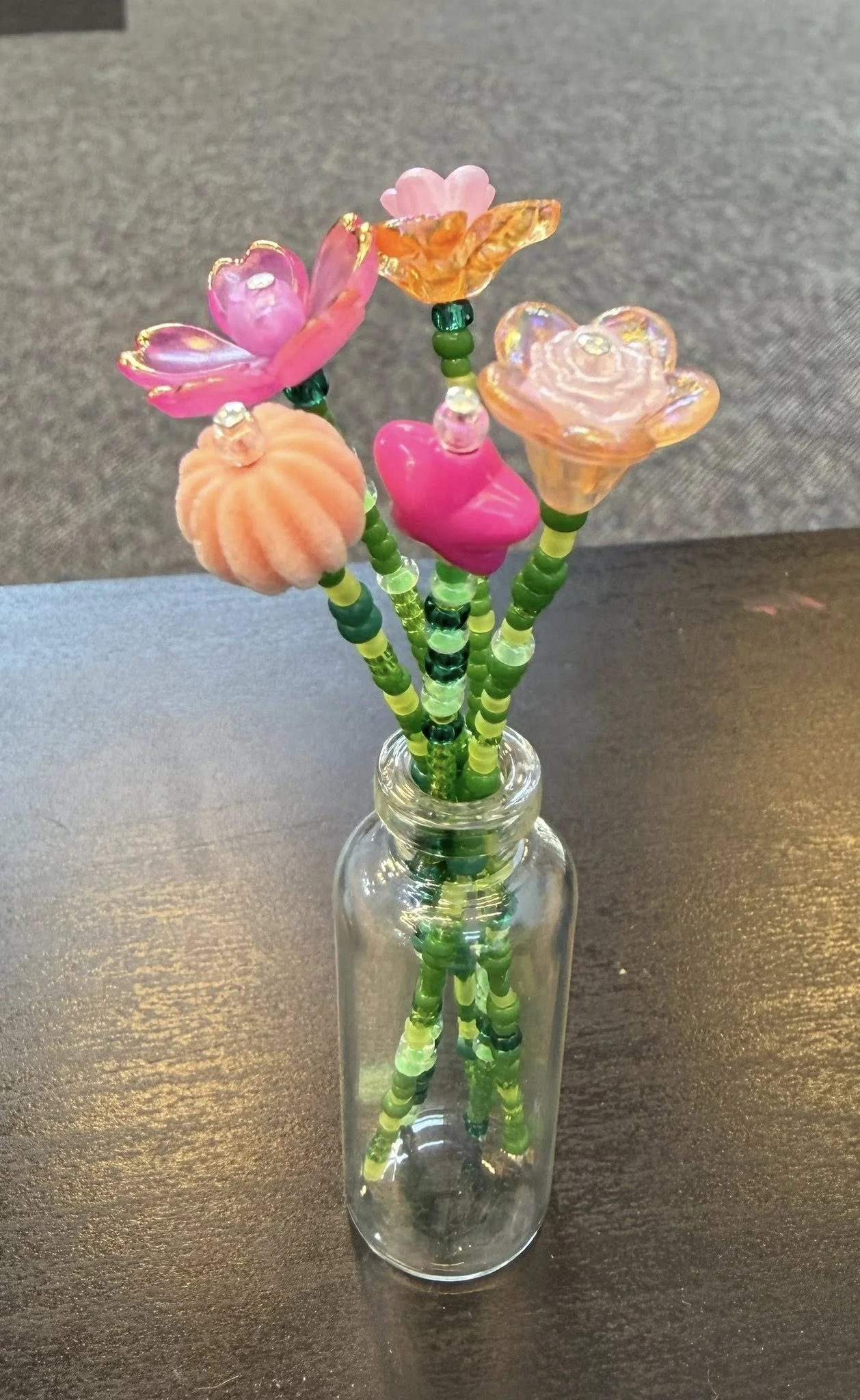 tiny flower arrangements with pink and orange.jpg