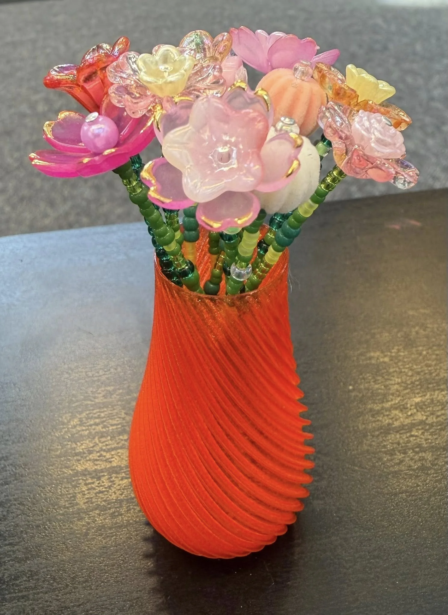 orange vase with pink and orange flowers.jpg
