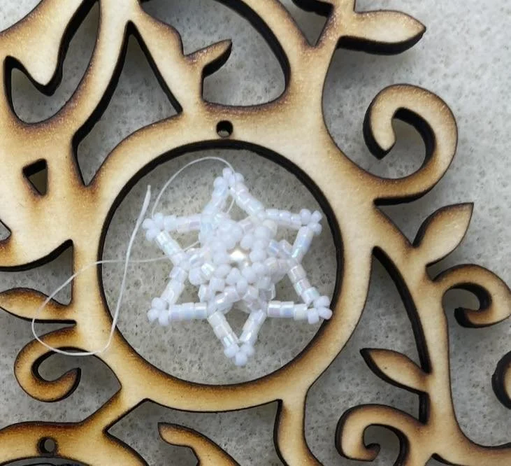 tiny snowflake ornament for wooden tree.jpg