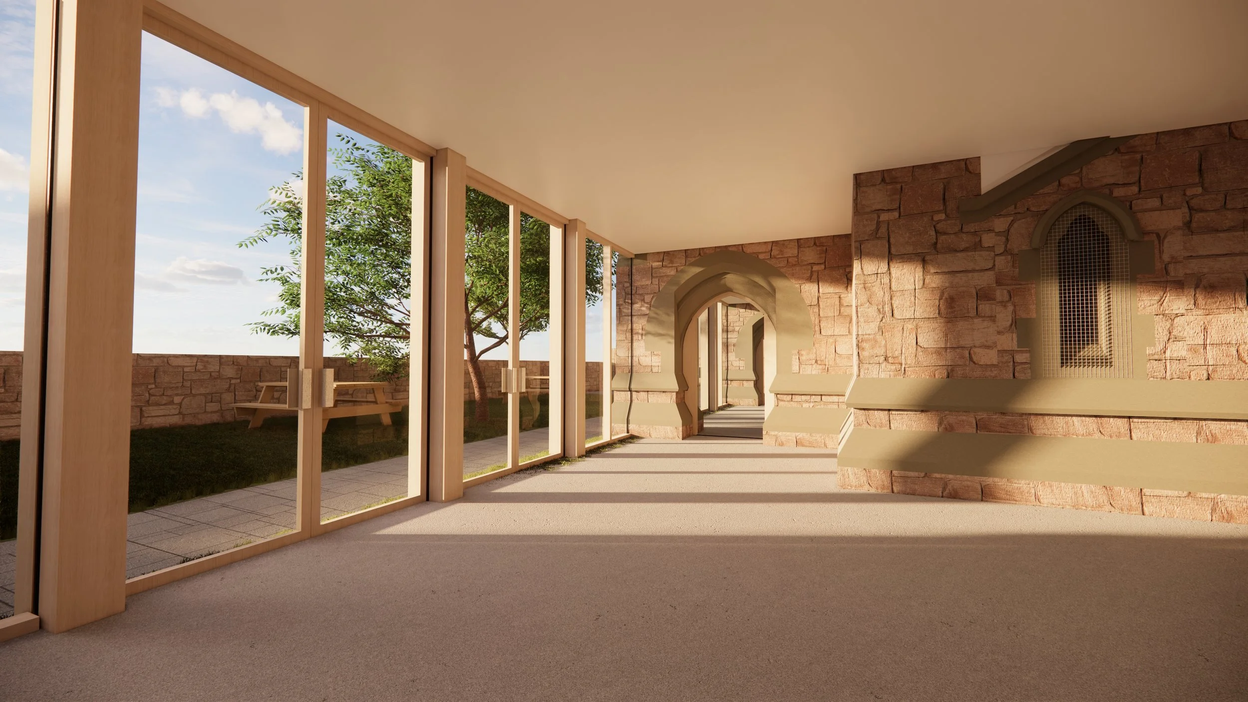 Sunlit interior with large glass doors, stone walls with arched openings, and a view of a garden with trees and a picnic table outside.