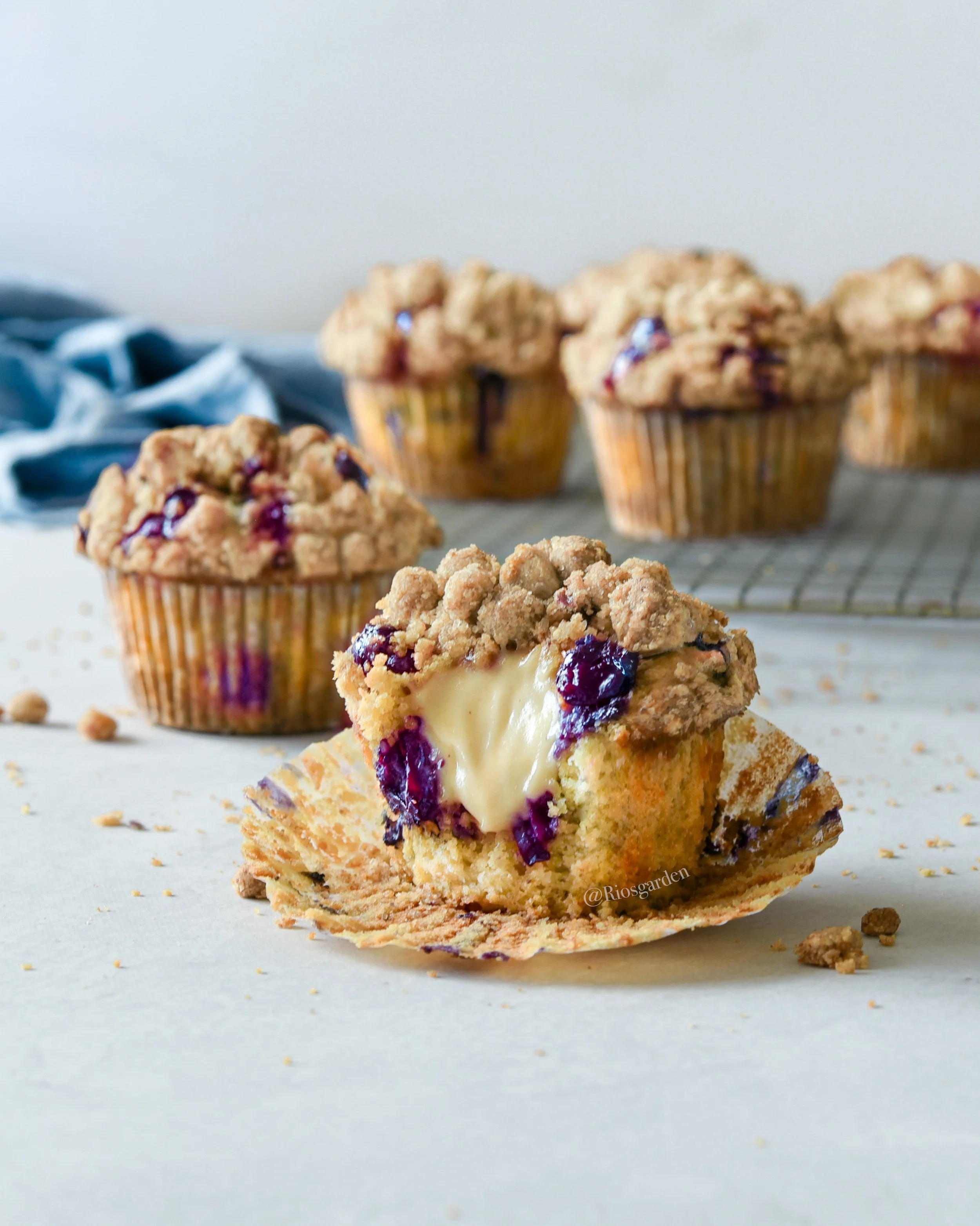 Blueberry crumble muffin with cream cheese filling