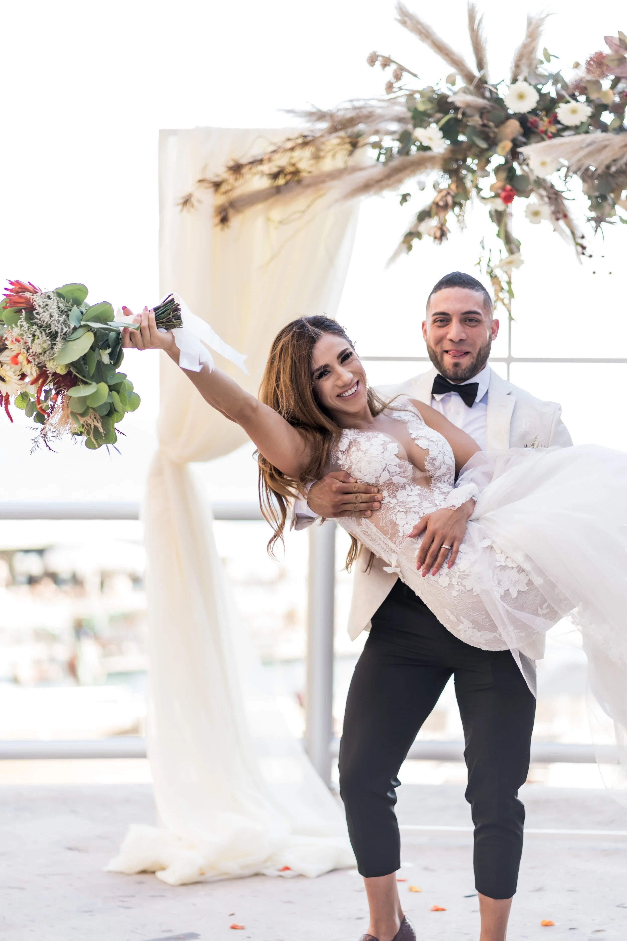 fun-destination-wedding-photos-groom-dipping-bride.jpg