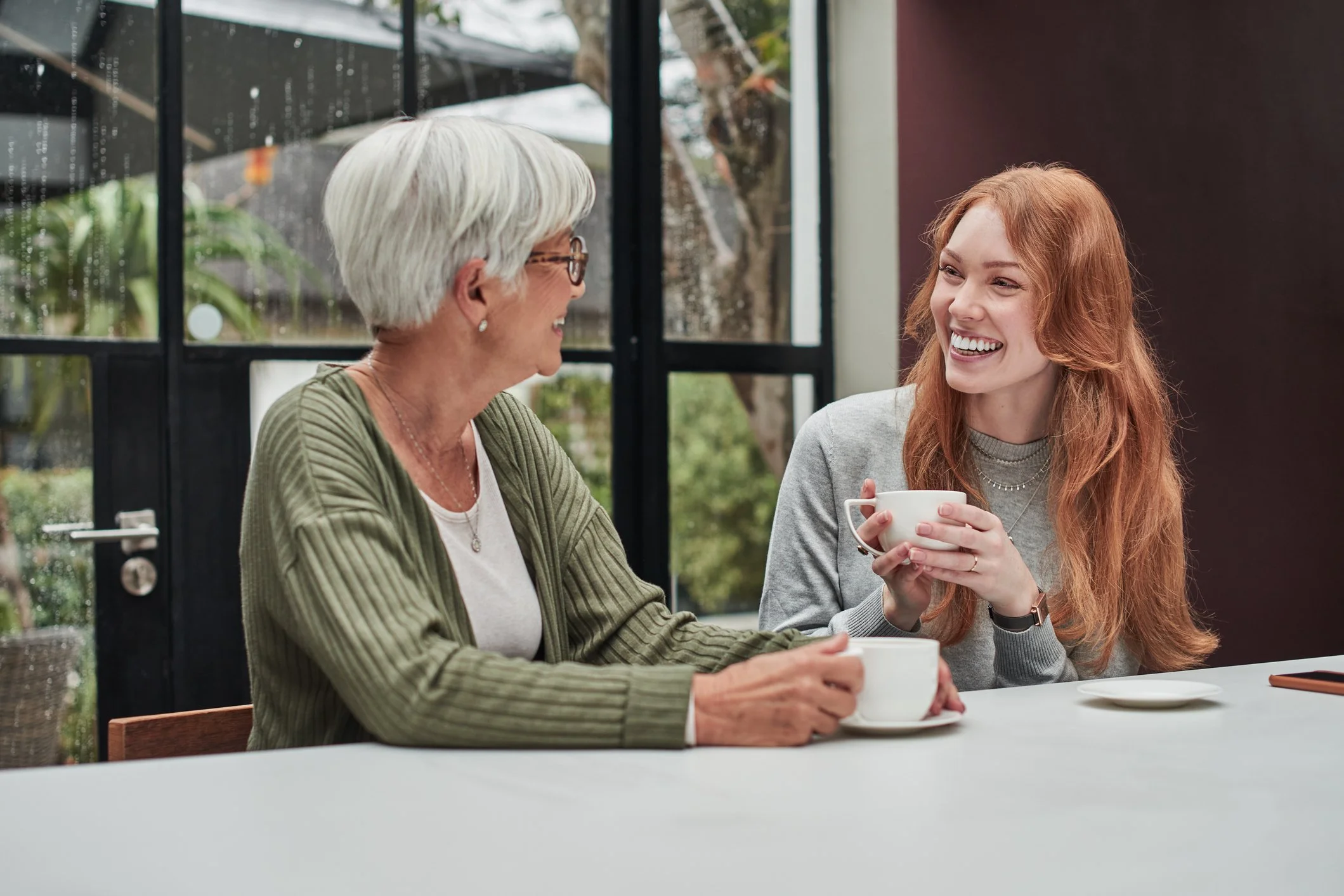 Mother Daughter at a Cafe having a pleasant conversation