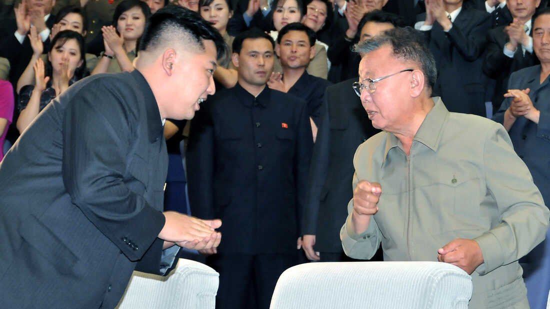  The late North Korean leader Kim Jong Il, right, exchanges words with his son and successor, Kim Jong Un, in July 2011 