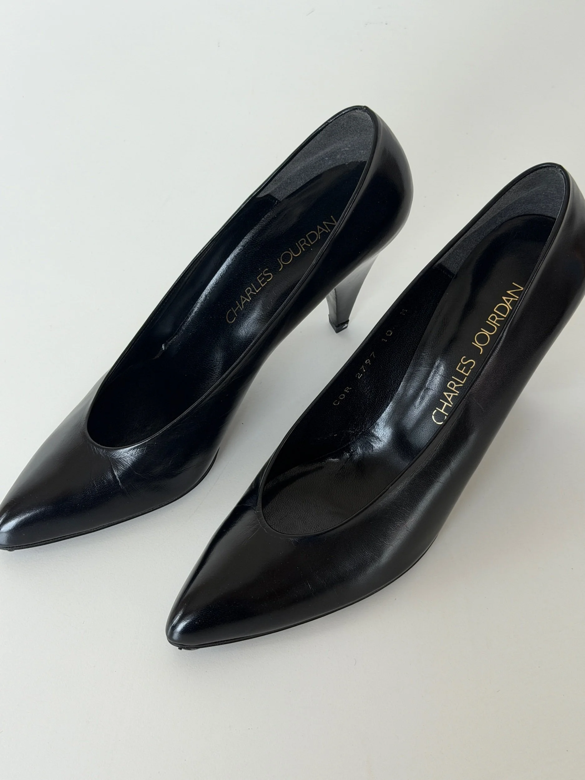 Vintage Charles Jourdan black leather pointed toe pumps with sculpted stiletto heel
