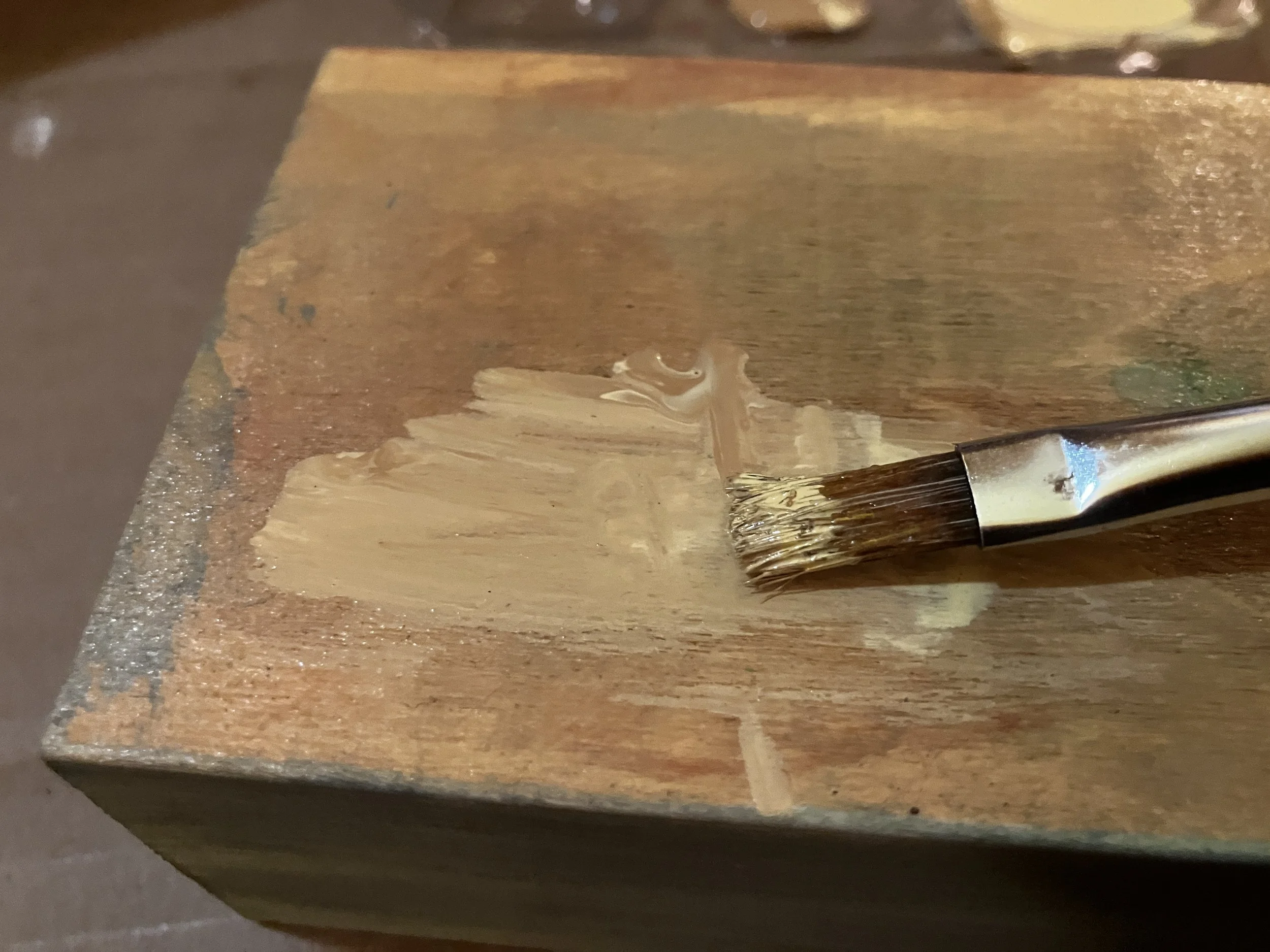 Layer splotches of Paint on wood surface before image transfer