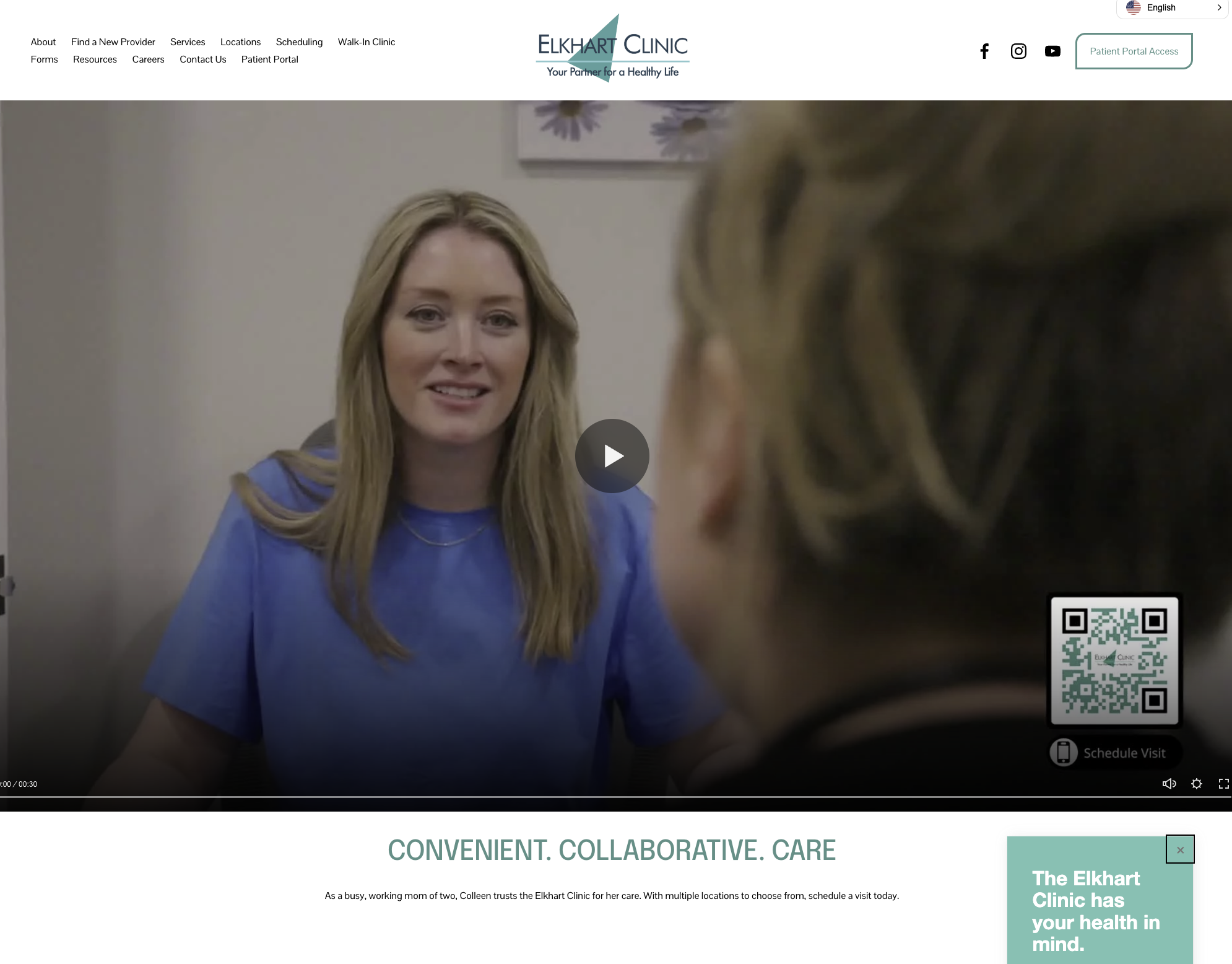 A woman with long blonde hair smiling and talking to a person with braided blonde hair. They are in a medical office setting.