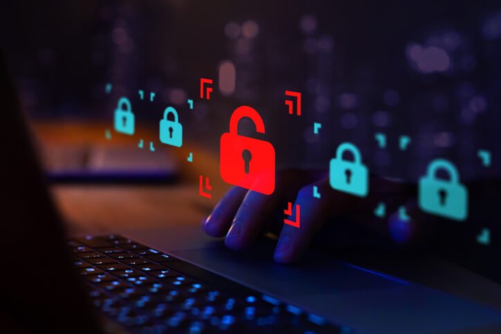 Laptop with digital lock icons illustrating data security risks during company laptop returns