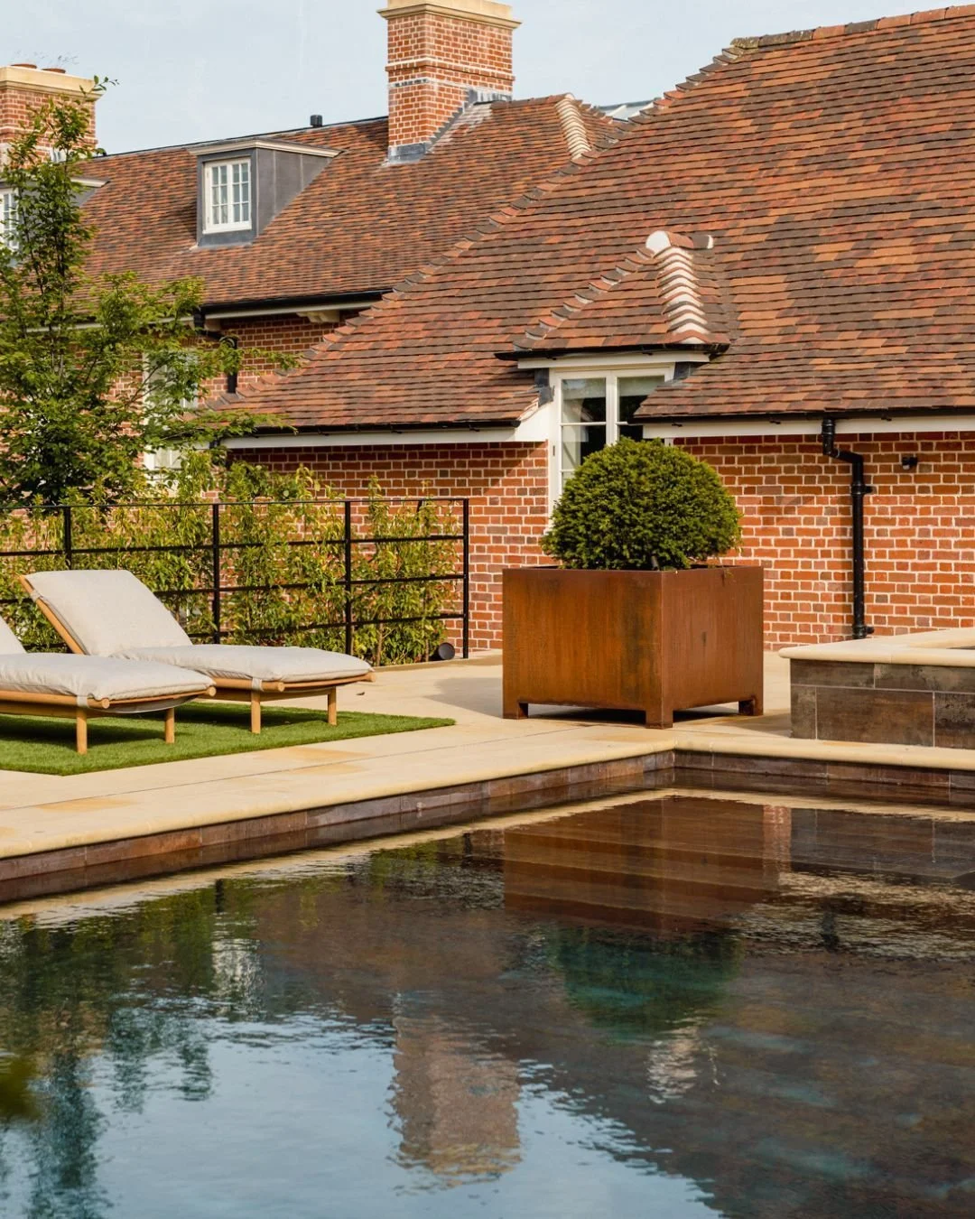 The sun is shining, and we're craving warm summer days, making this the perfect time to share these stunning shots ☀️

This inviting swimming pool is bordered by Darley Sawn paving and bullnosed copings, beautifully complementing the bricks and rusty