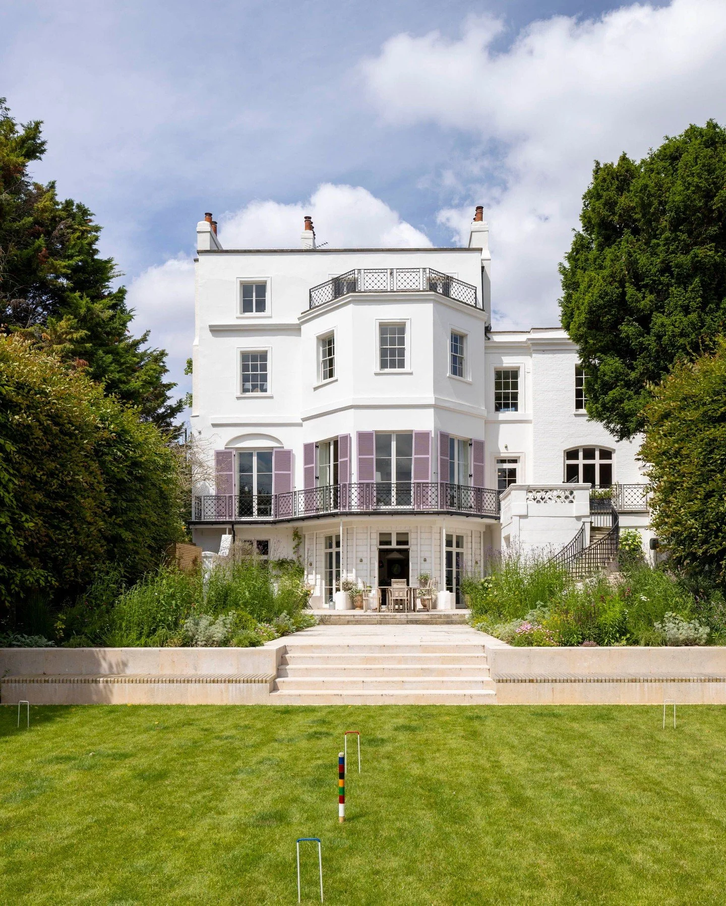 This is Ryan House, a Grade II listed Georgian building from the early 19th century, located in Twickenham. 

This historic property has recently been renovated, and we are proud to have supplied Bianca Paving and steps to enhance the riverside garde