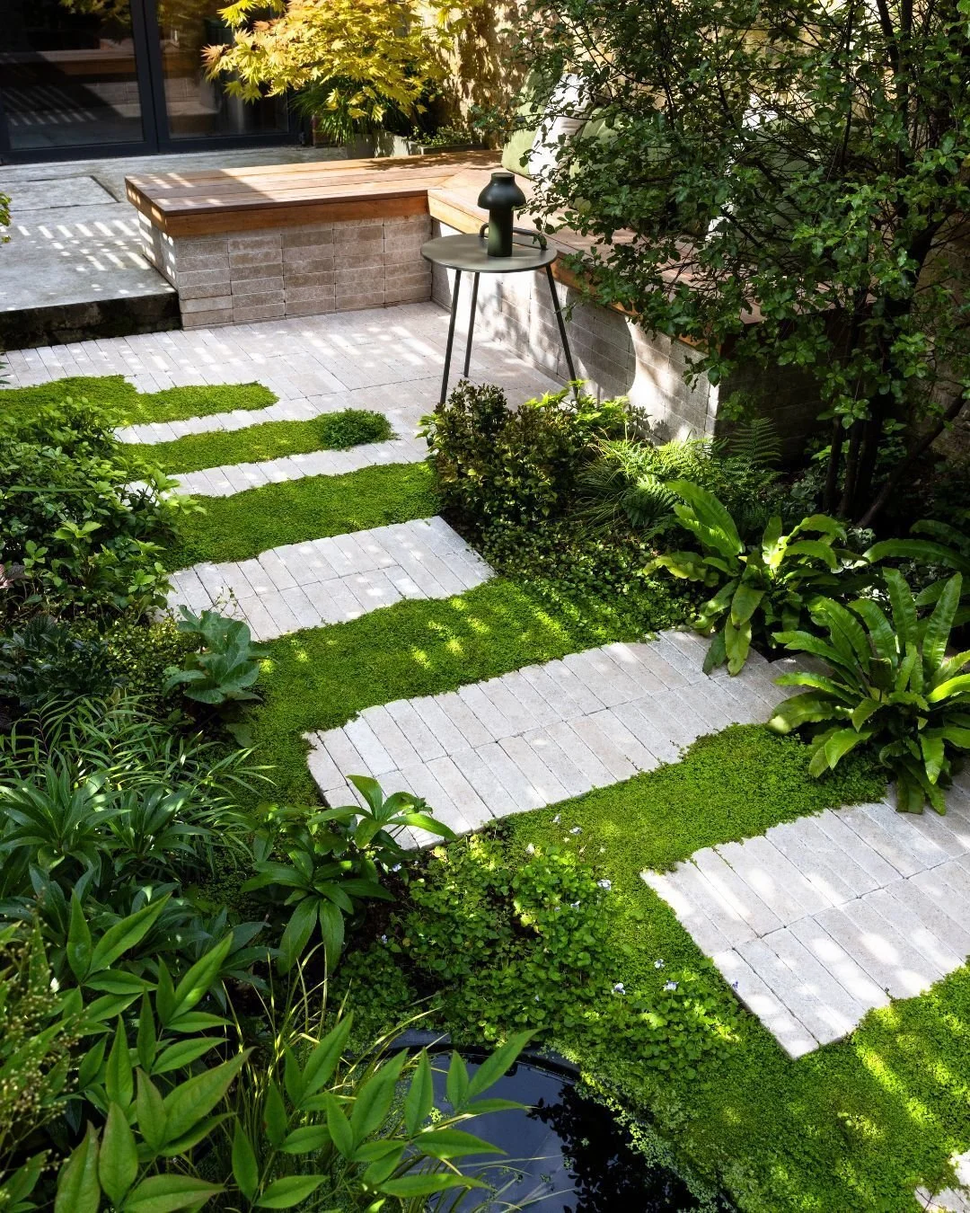 This gorgeous garden proves that a space can be small yet full of character 🌿

Zahra Beige Stackers, arranged as stepping stones, gently guide you through the garden, creating a path through the lush greenery. 

Credits:
Design @eastlondongardendesi