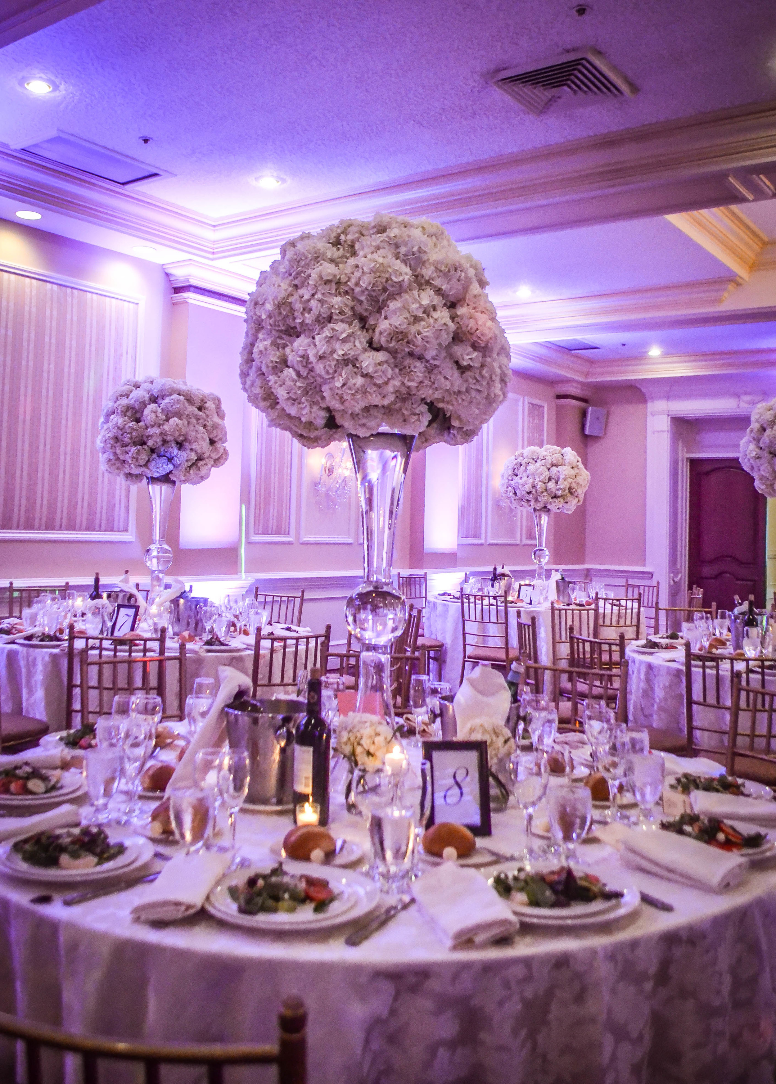 Extra large white hydrangea centerpieces in tall trumpet vases. Inn at New Hyde Park. Long Island. Rosehip Social, Brooklyn, NY.