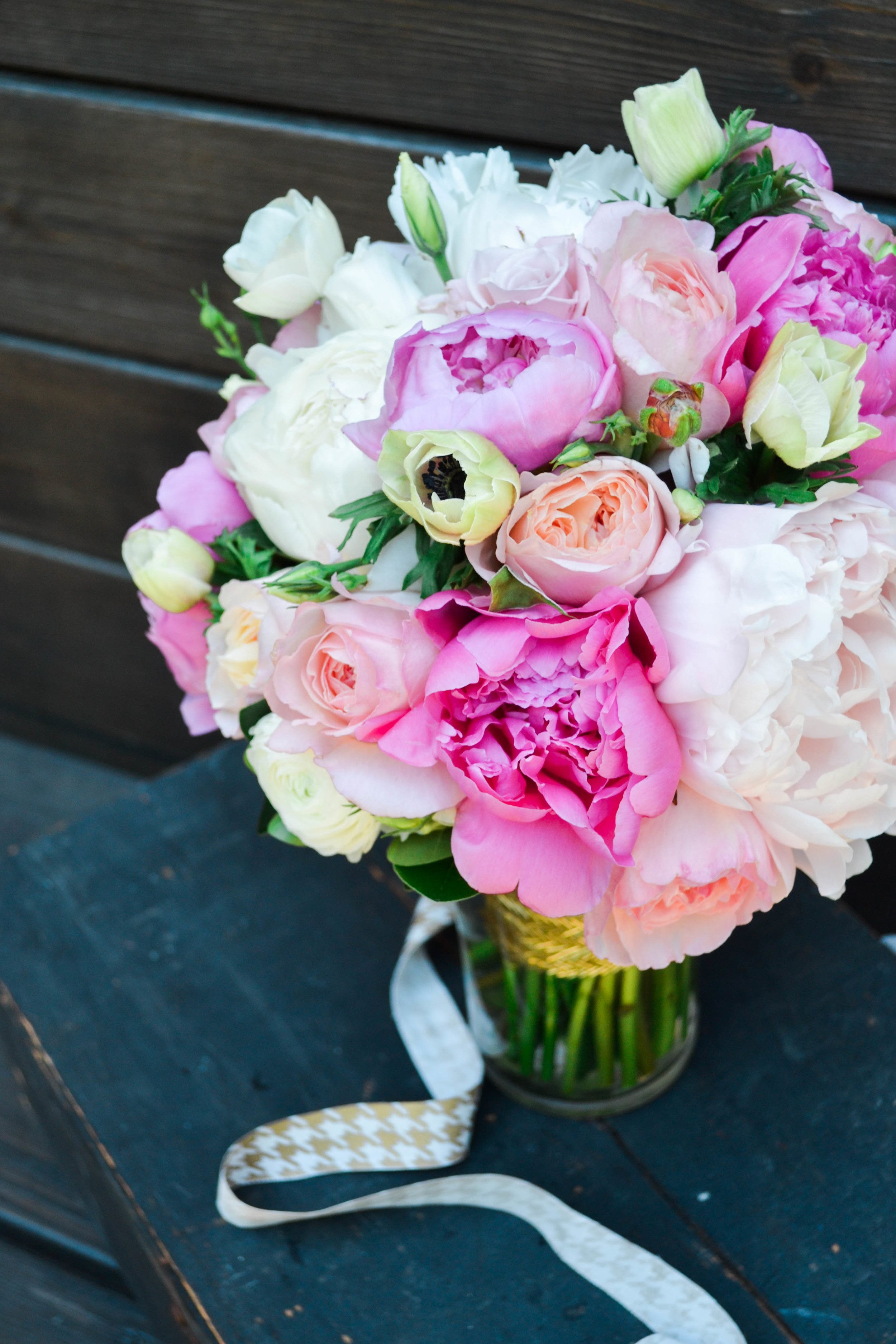 Bridal bouquet of pink and white radunculus and anemones.  Rosehip Social, Brooklyn, NY.
