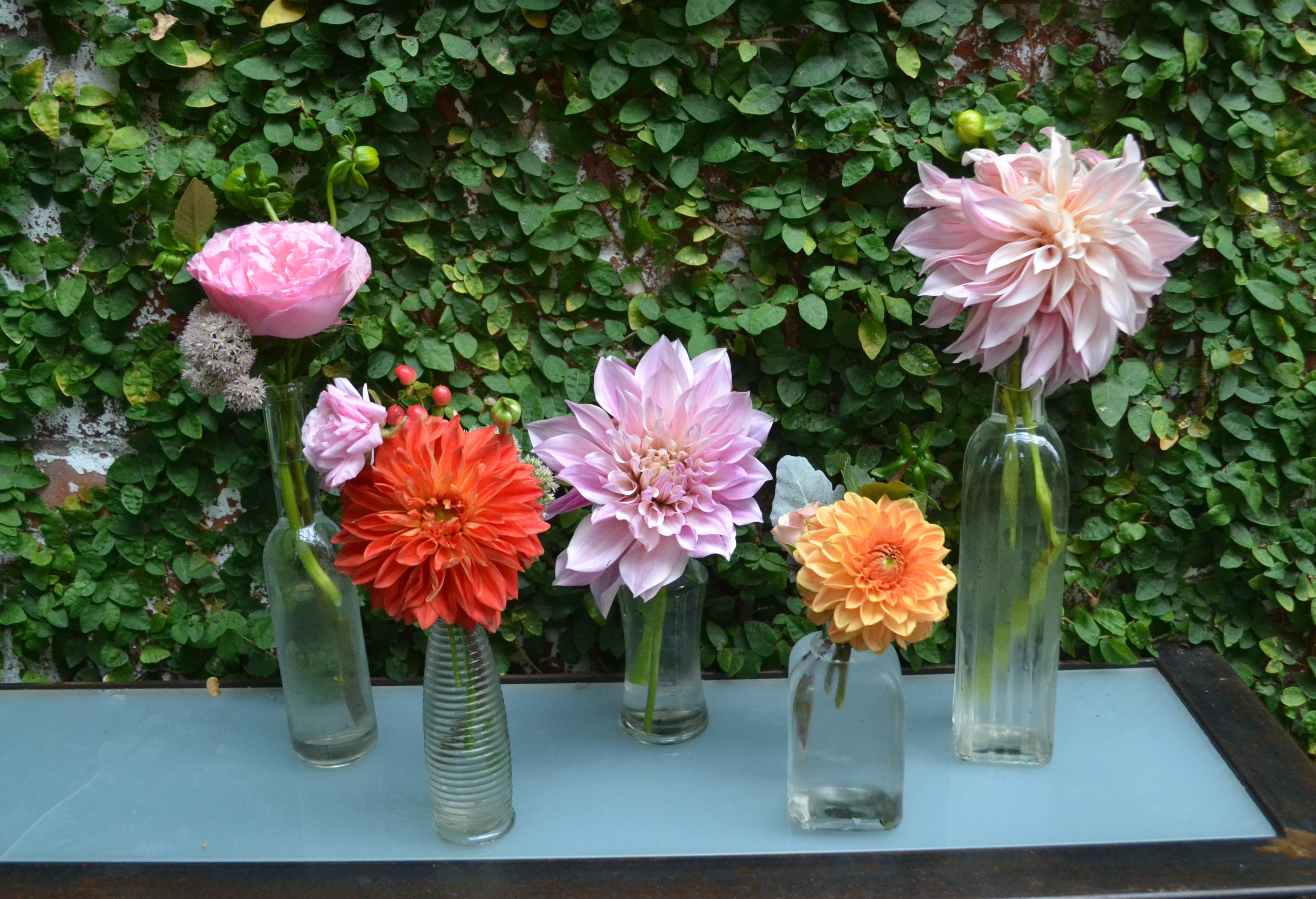 Bud vases filled with dahlias and garden roses. Foundry cocktail hour. LIC Wedding. Rosehip Social. 