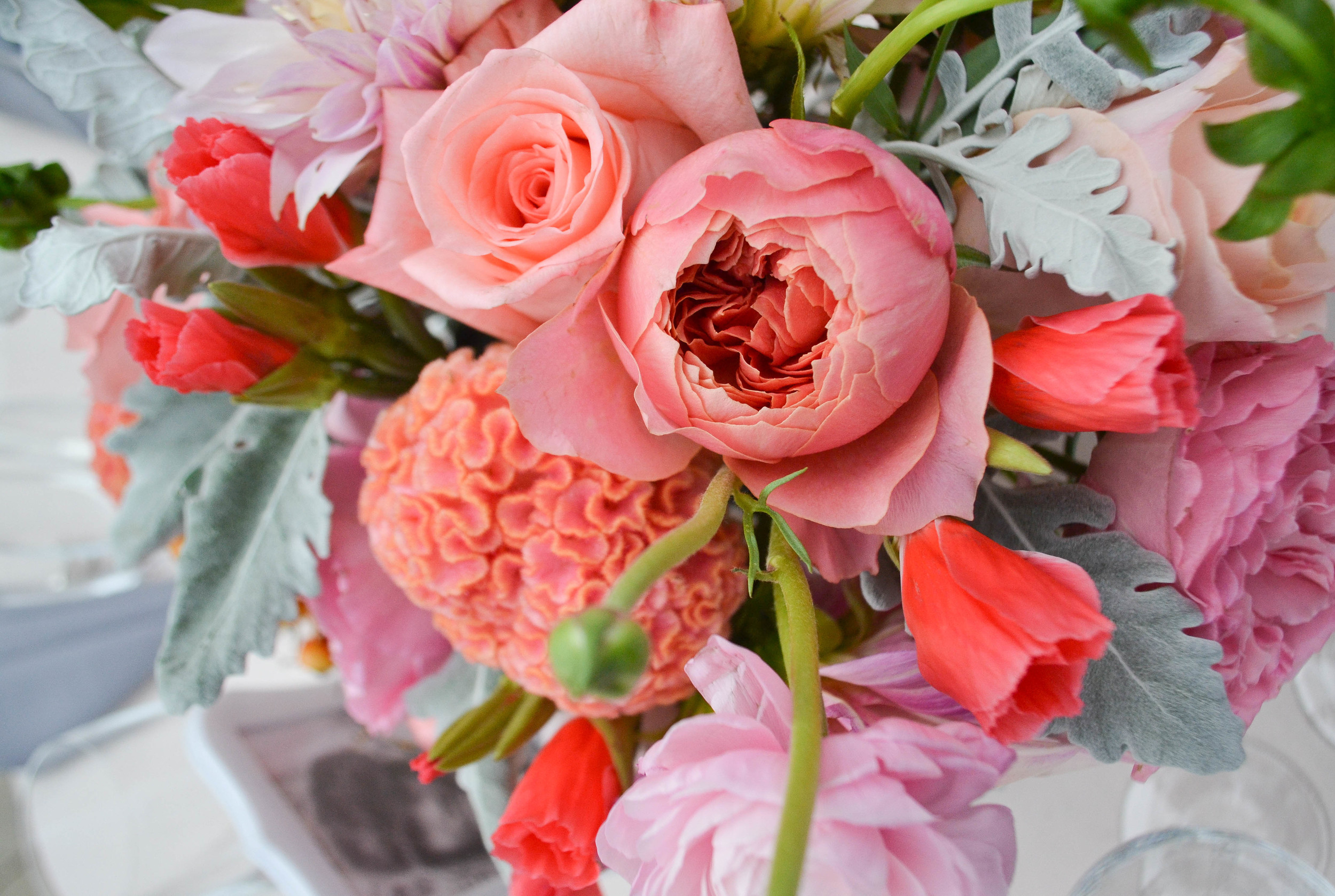 Peach toned dahlias and garden rose centerpiece with silvery greens and raspberry pink accent flowers. Foundry LIC wedding. Rosehip Brooklyn