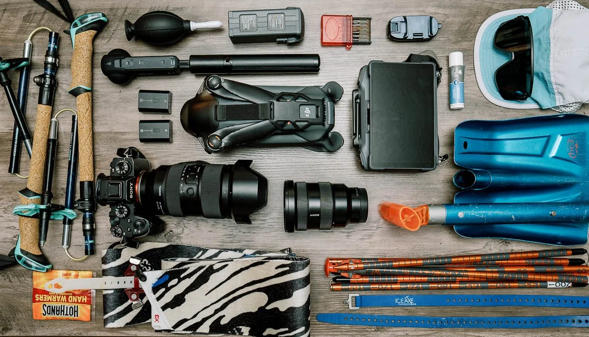 photographer's gear back laid out on a table