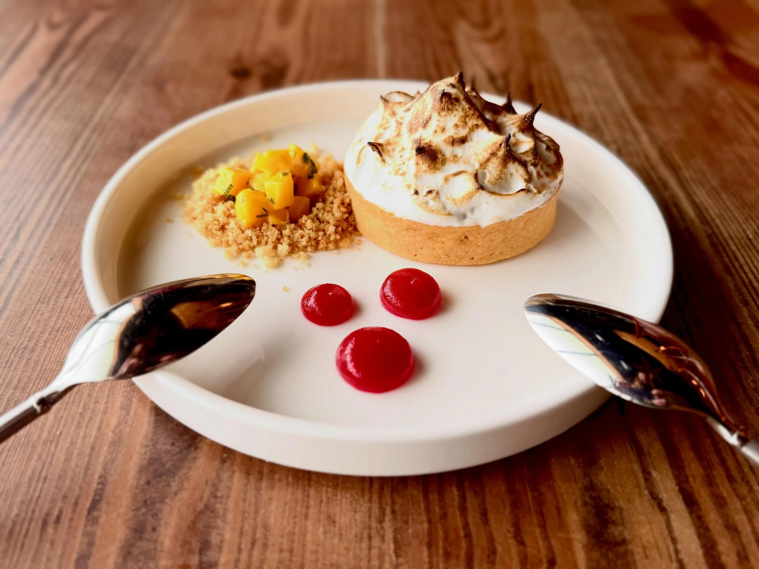 Too pretty to eat. Almost.

Our new dessert feature is as beautiful as it is delicious: a Passion Fruit Curd Tartlet topped with toasted vanilla-citrus meringue, with prickly pear gel, and mango-mint relish. Bright colors, vibrant flavors, and just t