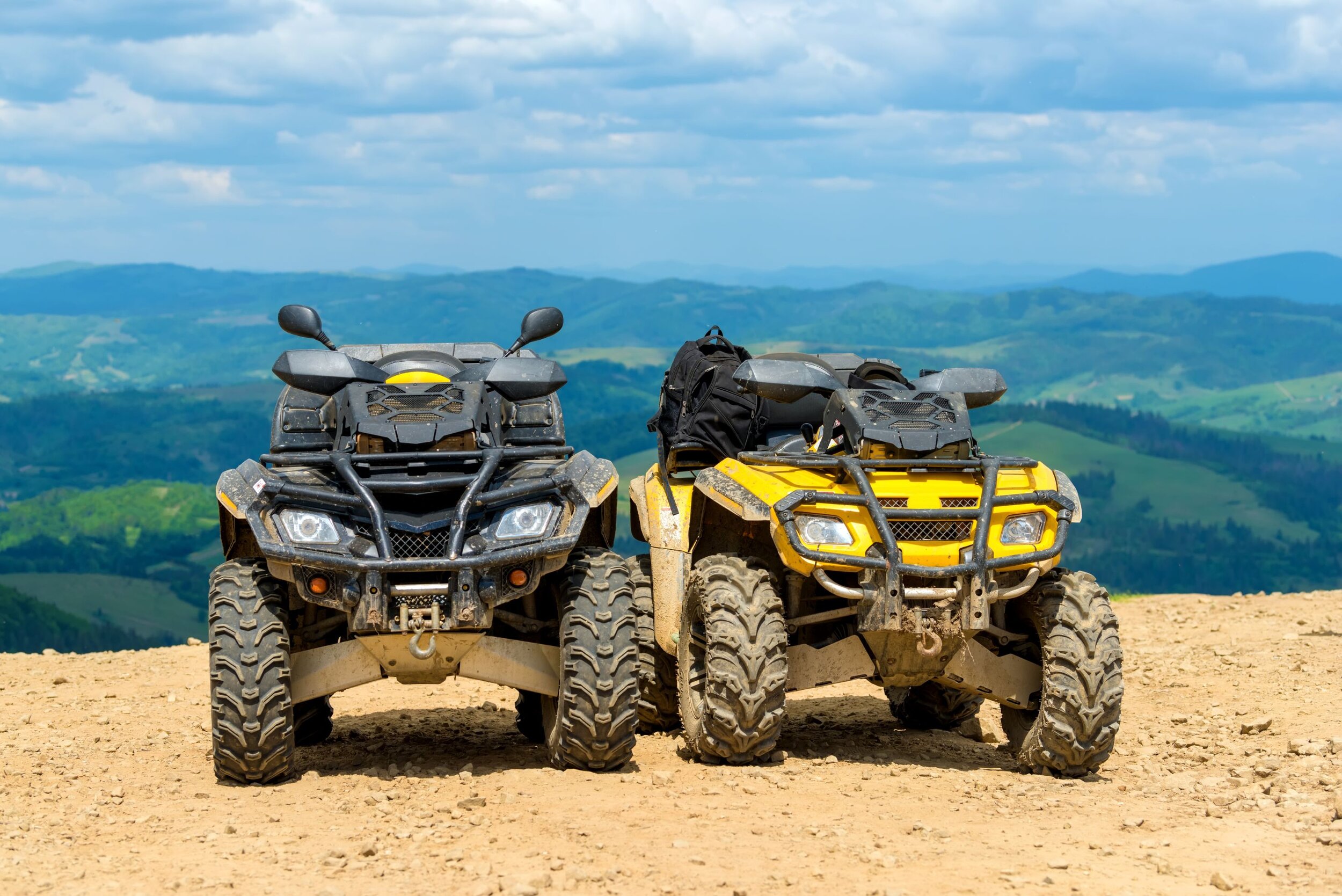 atv-quad-bike-in-front-of-mountains-landscape-3CDVTNX.jpg