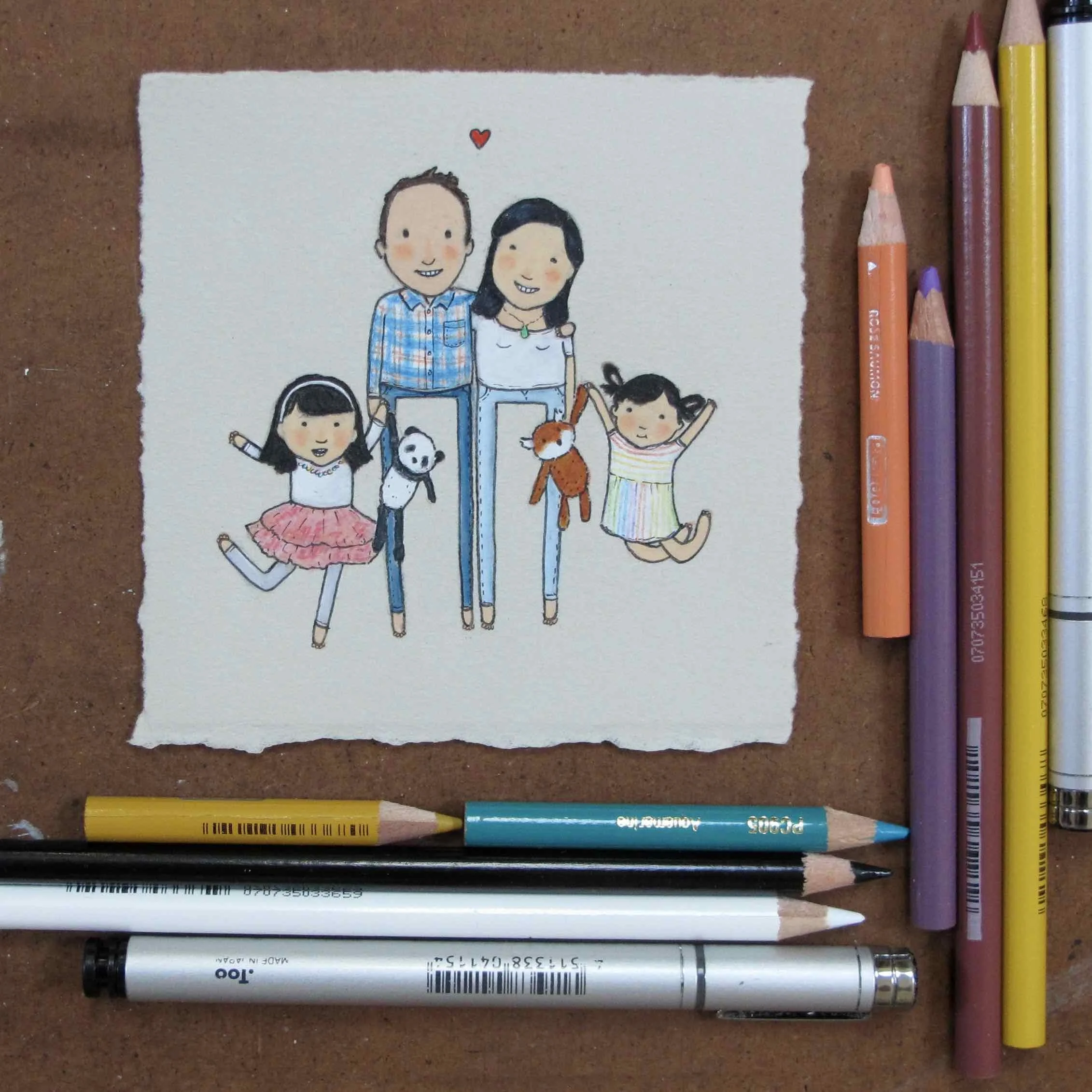 little family portrait with girls jumping and holding their stuffs