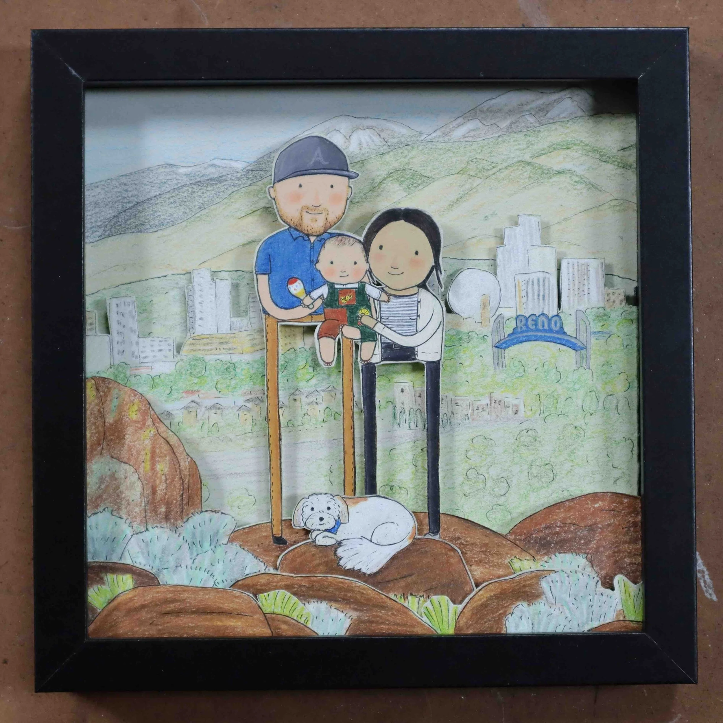 shadow box portrait of couple and baby with dog on a hill in Reno Nevada