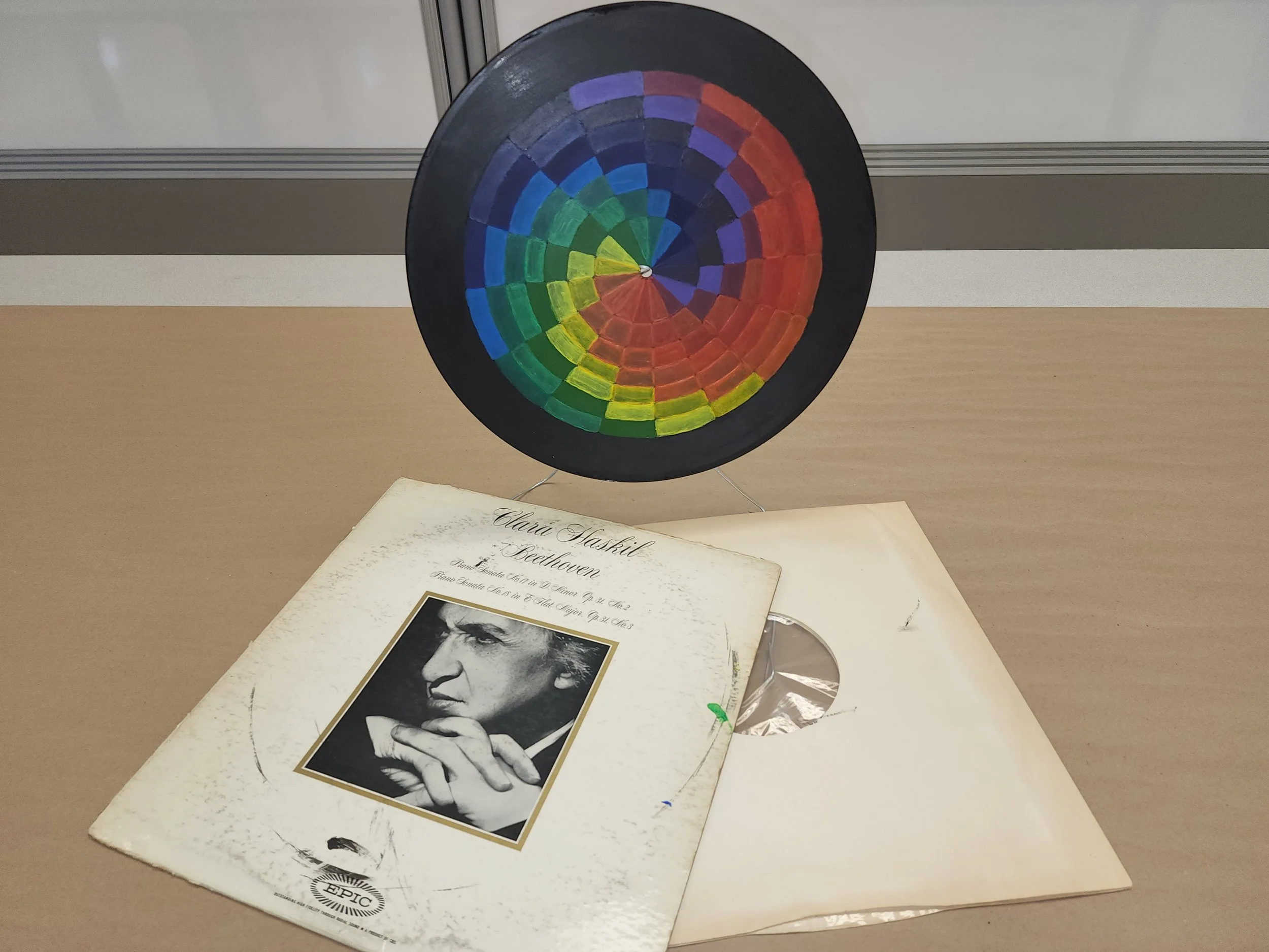 A colorful spiral on a vinyl record.