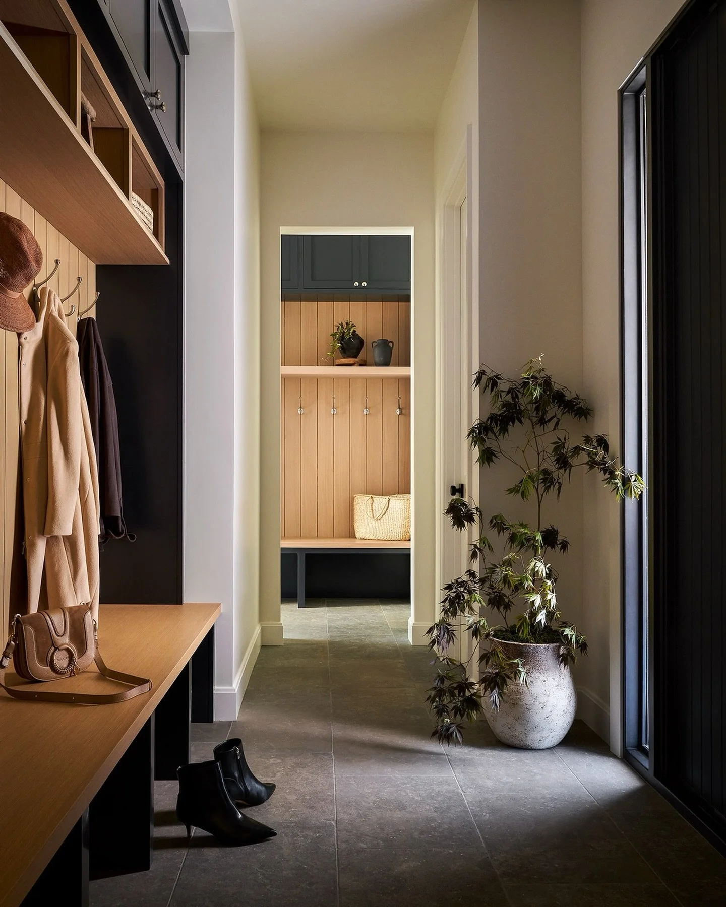 What&rsquo;s better than one mudroom? Two!

We designed the back of the house to create a mudroom for guests as they enter, along with a secondary mudroom for our clients off the garage. The two spaces had to visually connect and feel cohesive with o