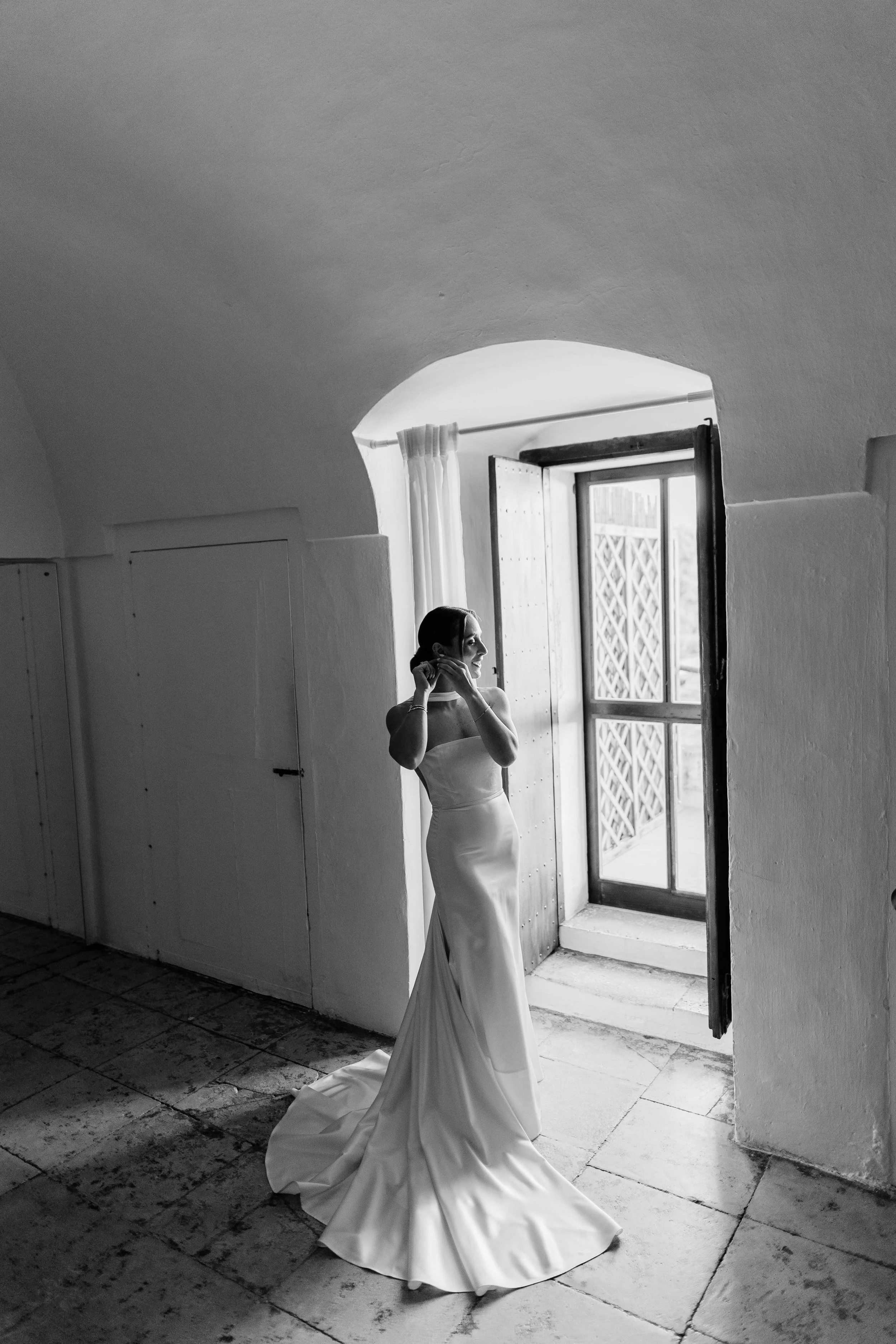Alumnus Joe Koueik collaborated with Lara Slim to create her wedding gown: a sculptural silk satin mermaid silhouette with an open back and detachable sheer elements, developed through careful pattern-making and fittings.