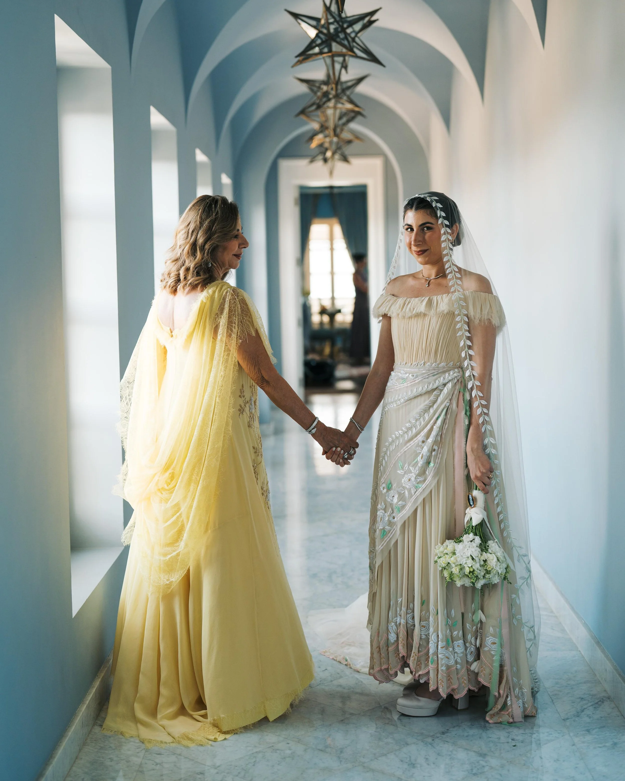 Wedding gown and mother of the bride’s dress by Amir Al Kasm.