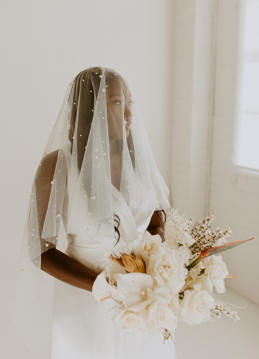  The Label RAIN wedding dress chic elegant styled wedding shoot with pearls by Abbey Rice Photography 