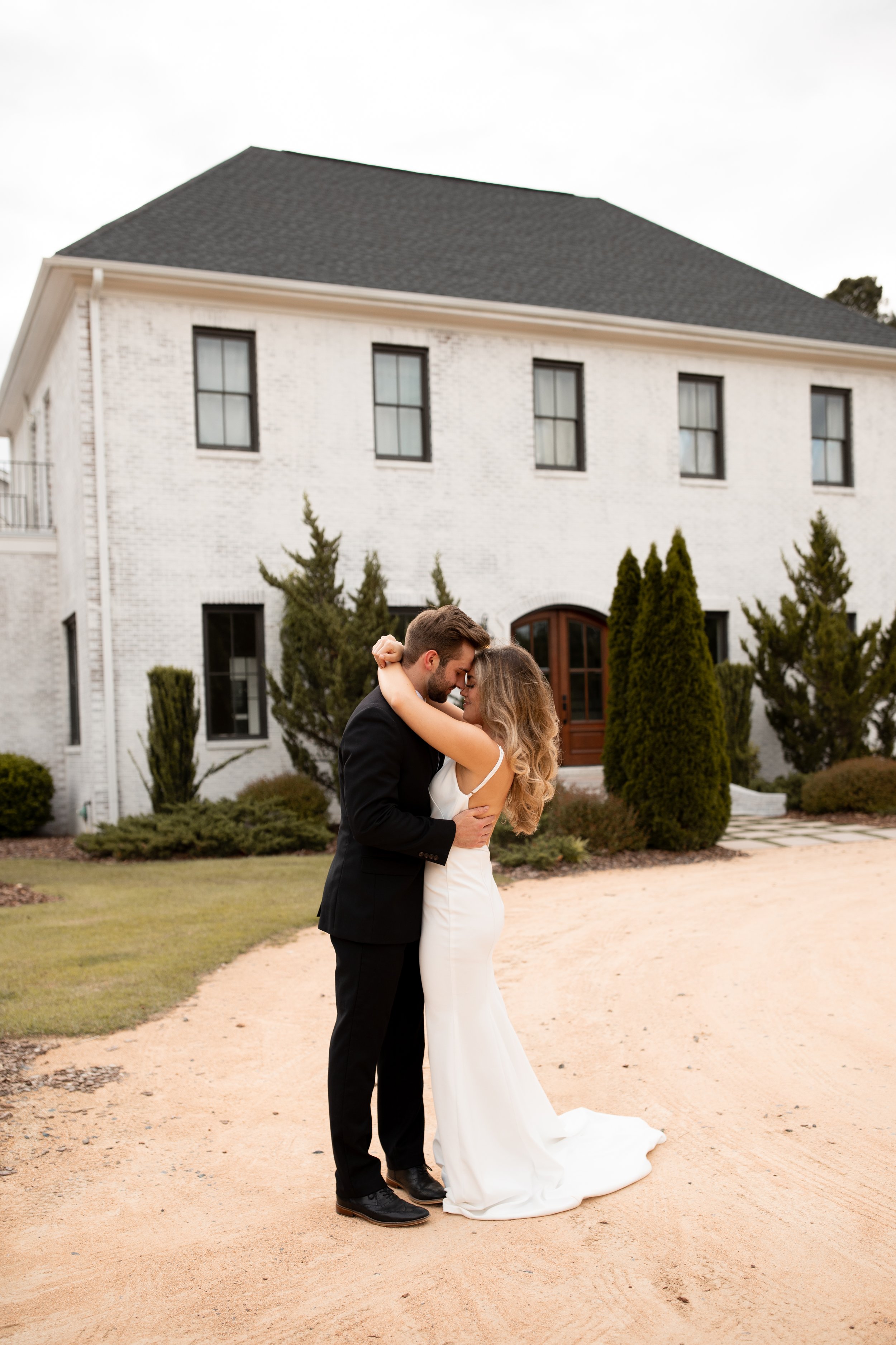 a sophisticated southern wedding at the bradford featuring a modern crepe fitted wedding dress by the label by aandbe and anna be bridal shops.