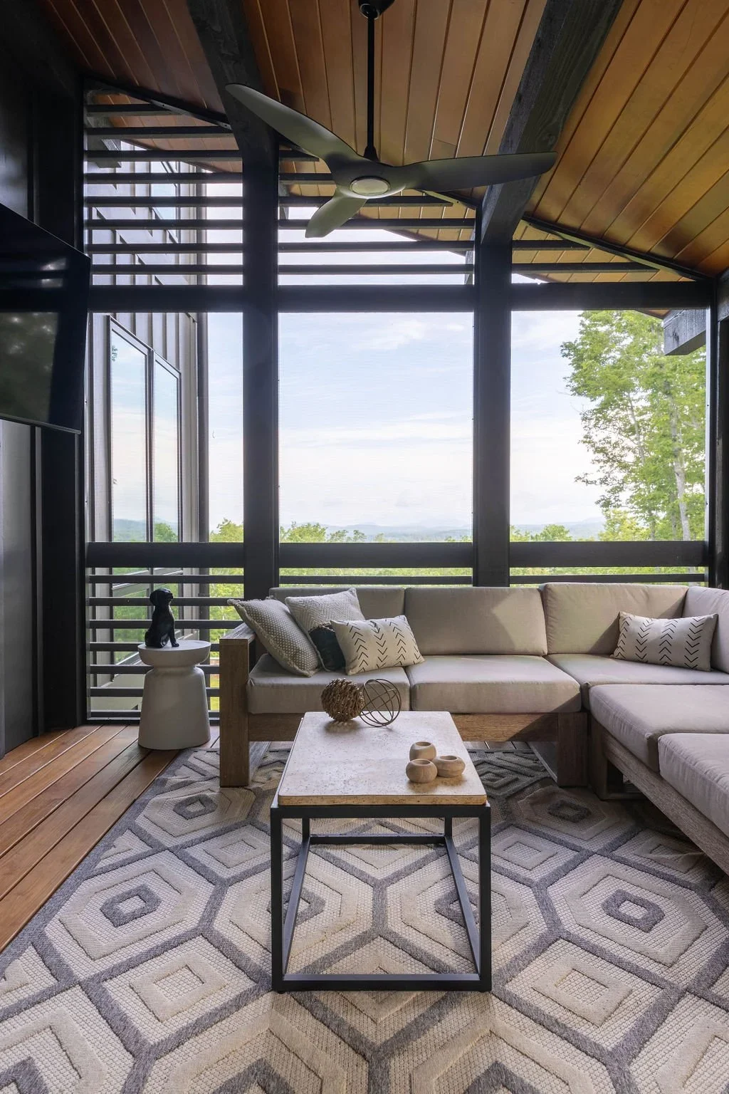 screened-patio-modern-rustic-malibu-mountain-home.webp