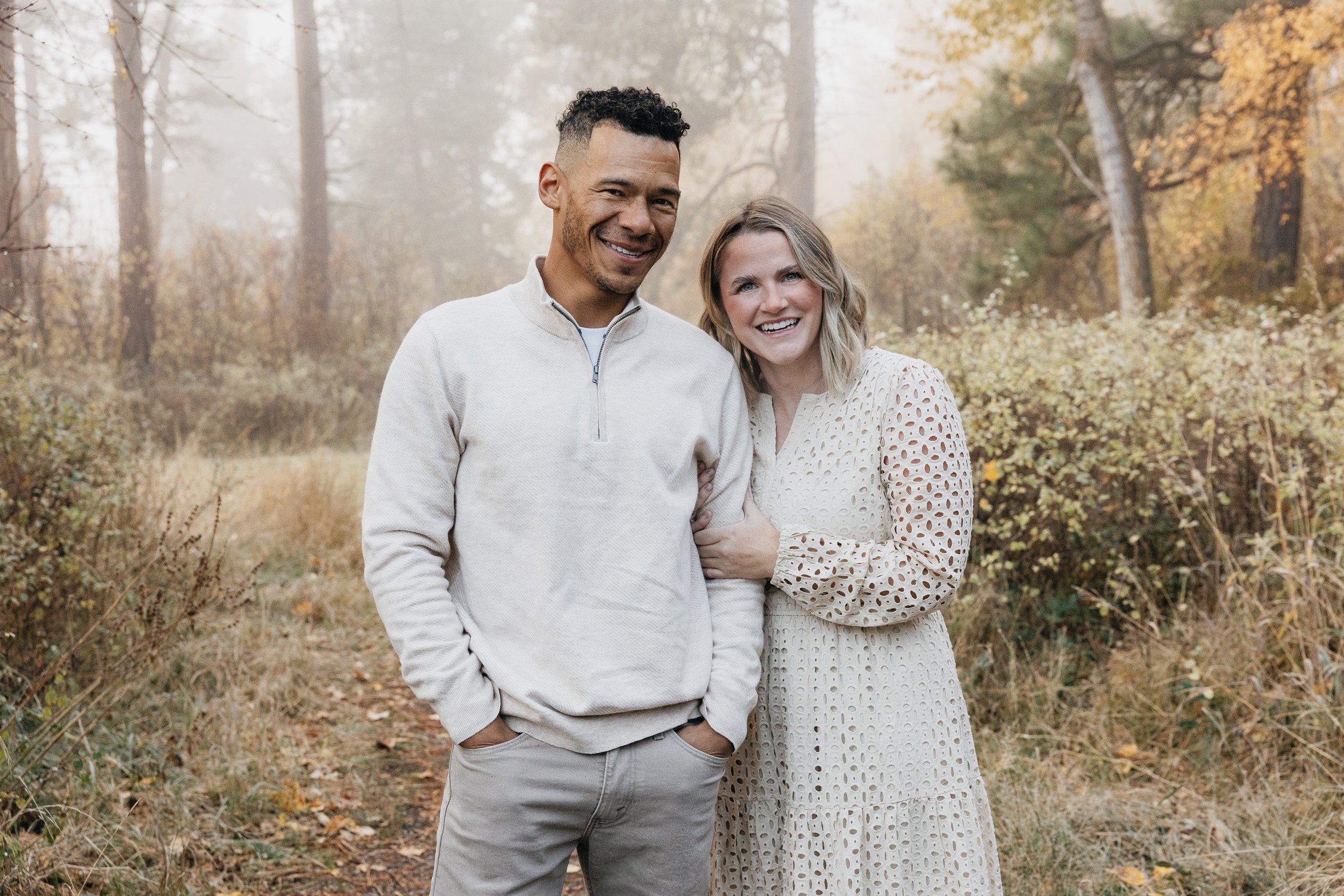 Fall family photo sessions with a Missoula photographer, capturing Montana families in colorful forest settings filled with autumn leaves.