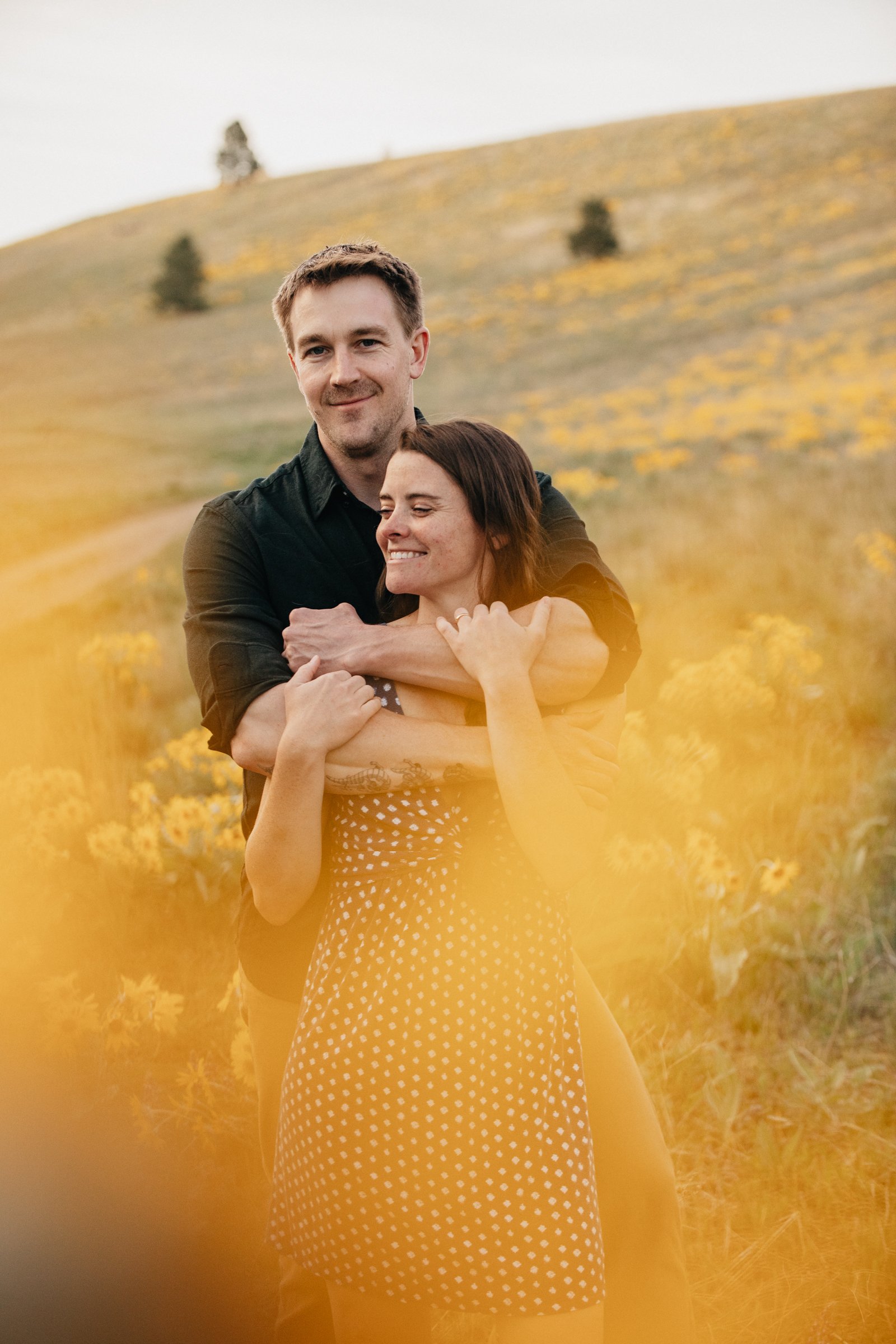 Montana wildflower engagement photography capturing real connection among blooming fields, mountain meadows, and golden evening light.
