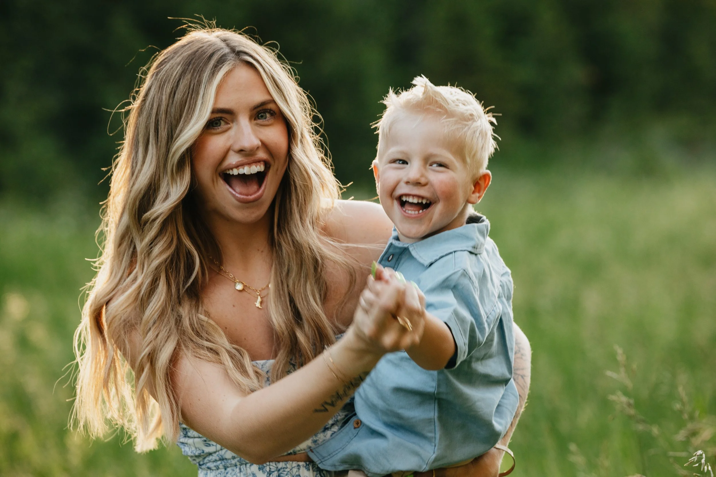 Summer family photography by a Missoula photographer, focused on candid, joyful moments with a family of three in natural Montana light.