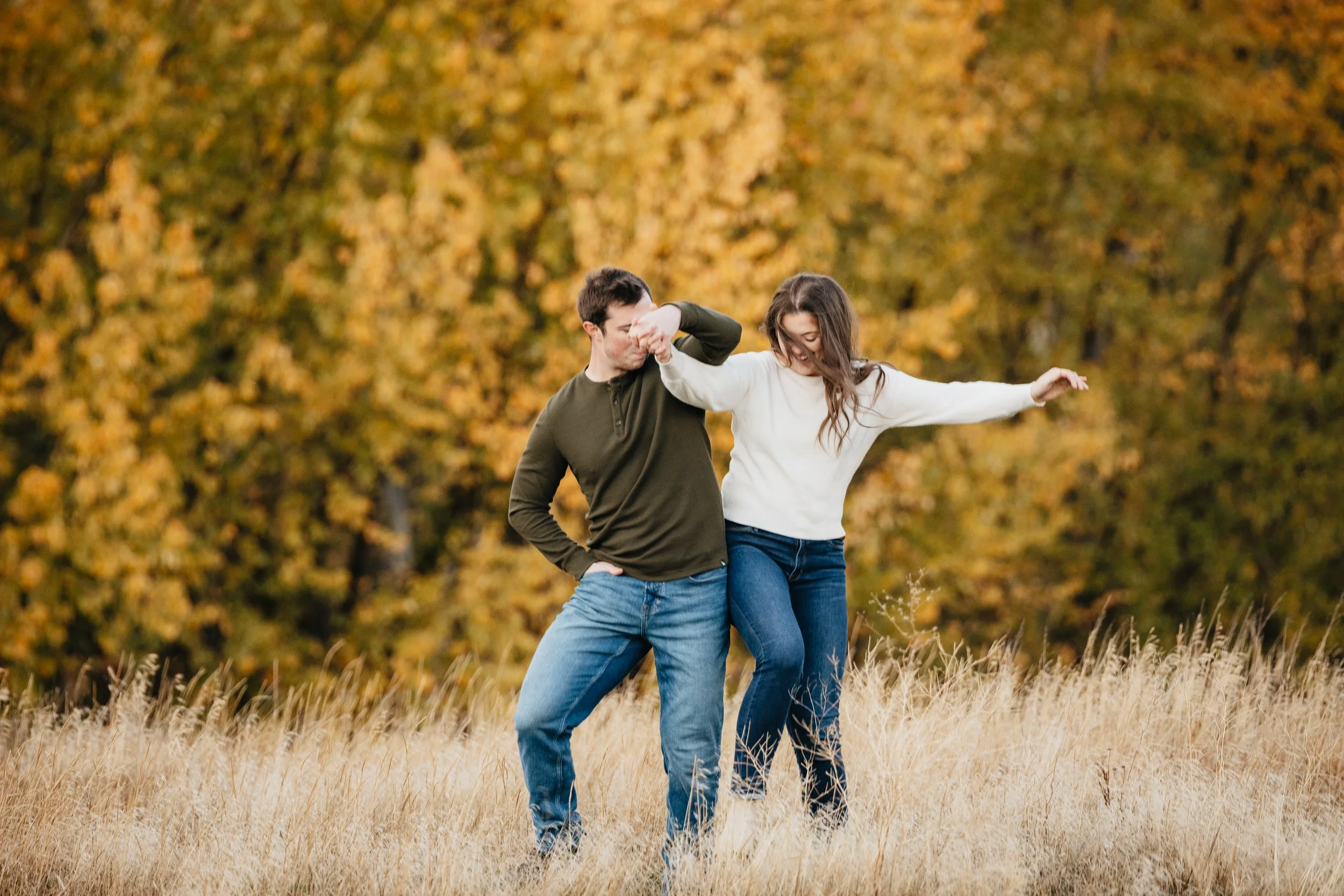 Romantic engagement photos of couples in Montana, capturing real connection against stunning mountain, forest, and big sky backdrops.