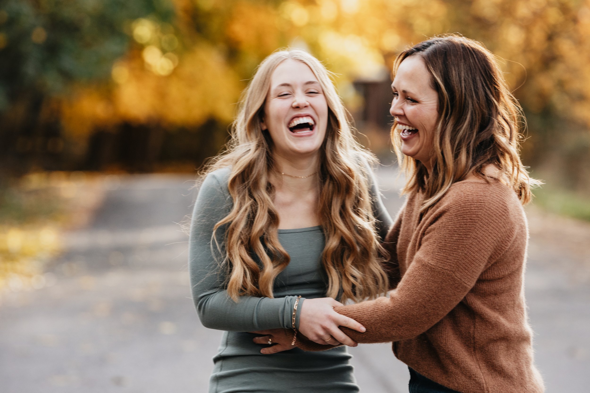 Montana family photographer specializing in autumn forest sessions, creating authentic, candid portraits among golden leaves in Missoula.