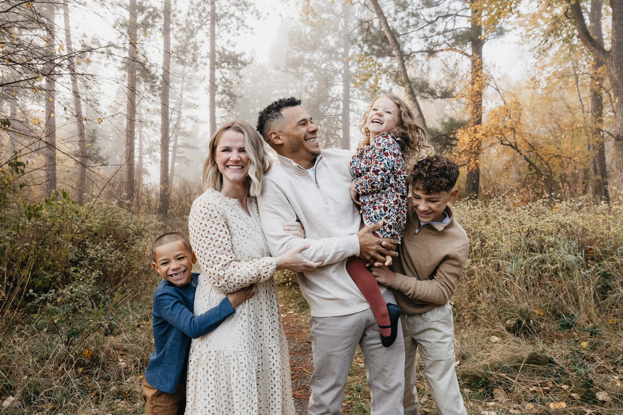 Montana family photographer offering Fall forest sessions in Missoula, focusing on warm tones, natural light, and genuine family connection.