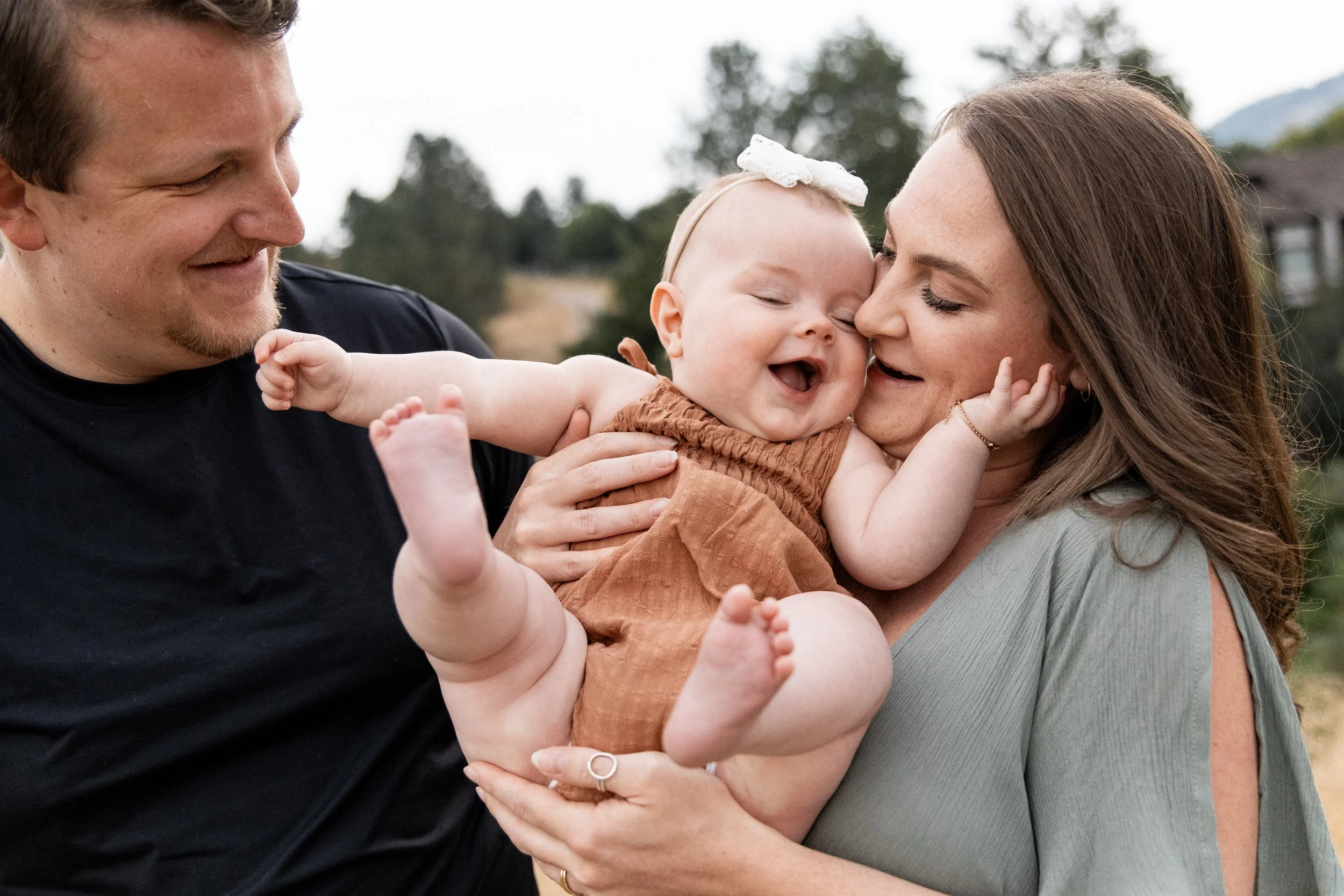Missoula family photographer capturing families in open Montana fields, featuring natural light, wide skies, and genuine connection.
