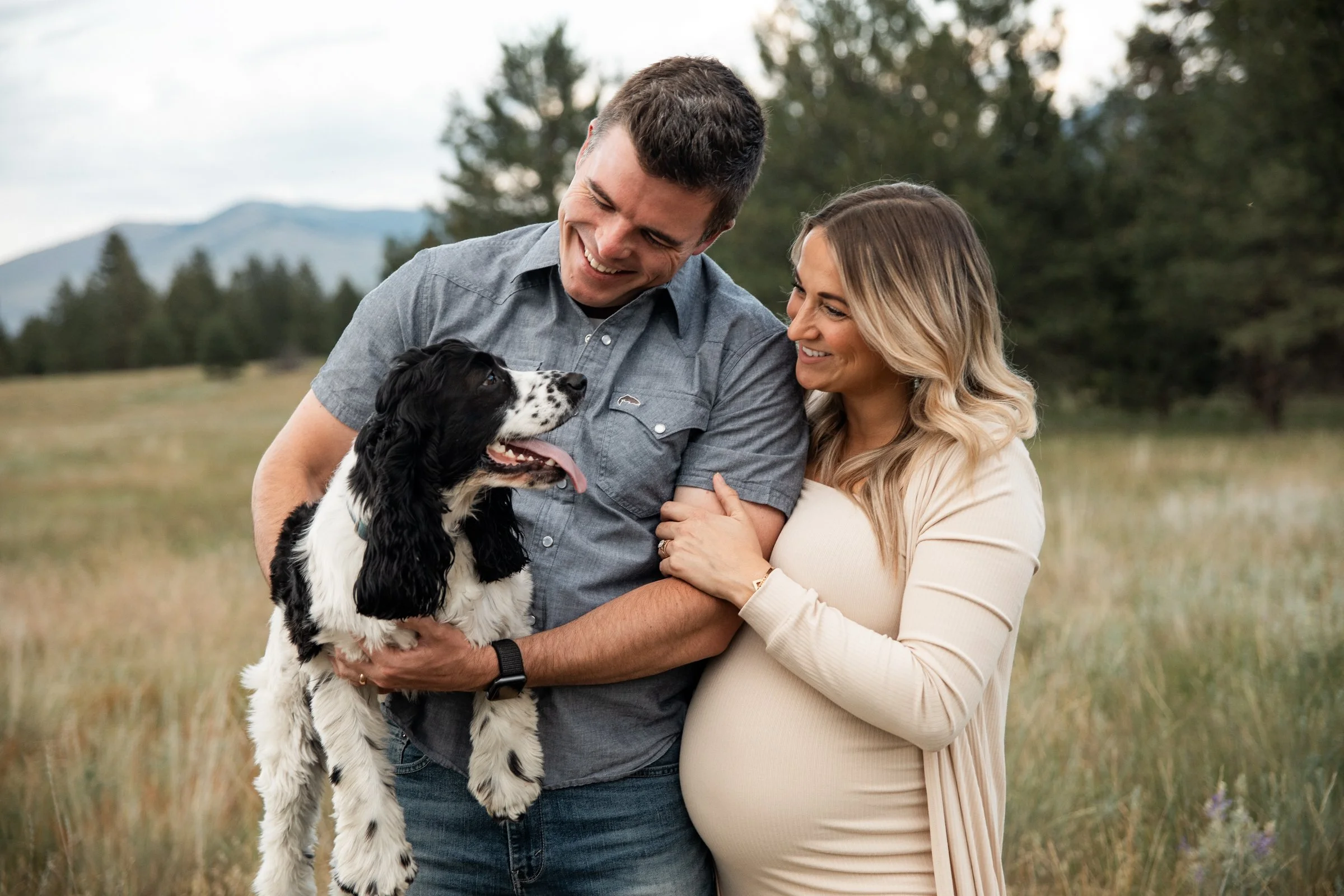 Montana maternity photographer offering field maternity sessions near Missoula, featuring mountains, warm light, and intimate moments before baby arrives.