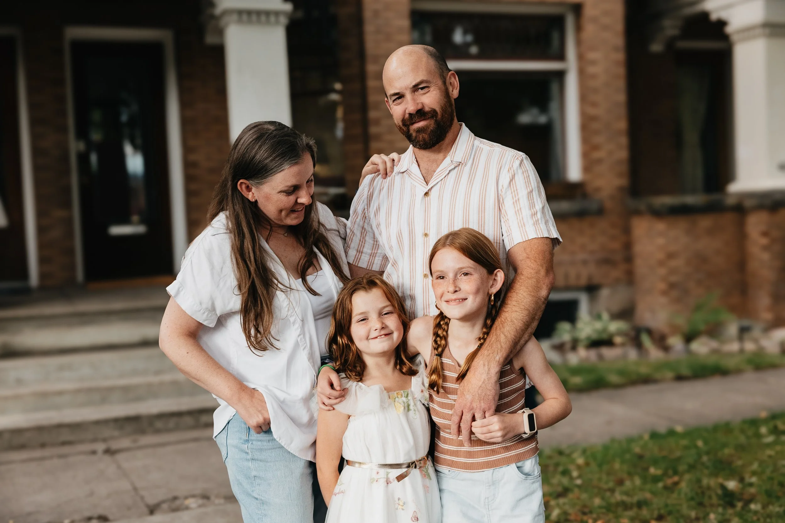 Montana in-home family sessions capturing parents, kids, and pets in relaxed, intimate, and playful moments.