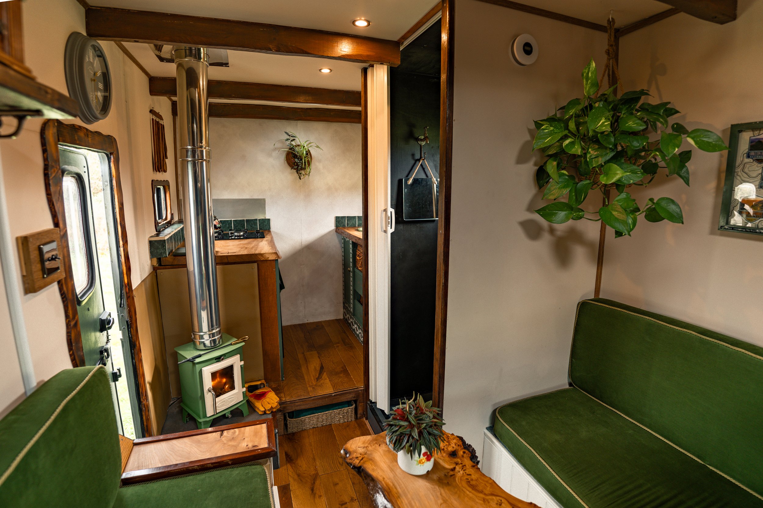 Interior of a self-built Bedford camper van featuring an LKQ EuroCarParts IndelB fridge, photographed during a long-term brand partnership on a vintage camper van restoration and conversion