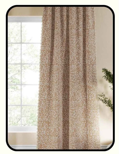 Nestig blackout curtains in a soft floral pattern hanging in a bright bedroom