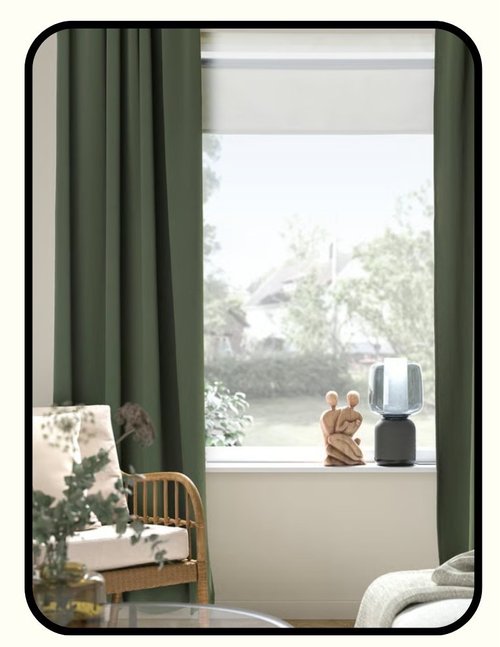IKEA blackout curtains hung in a bright window