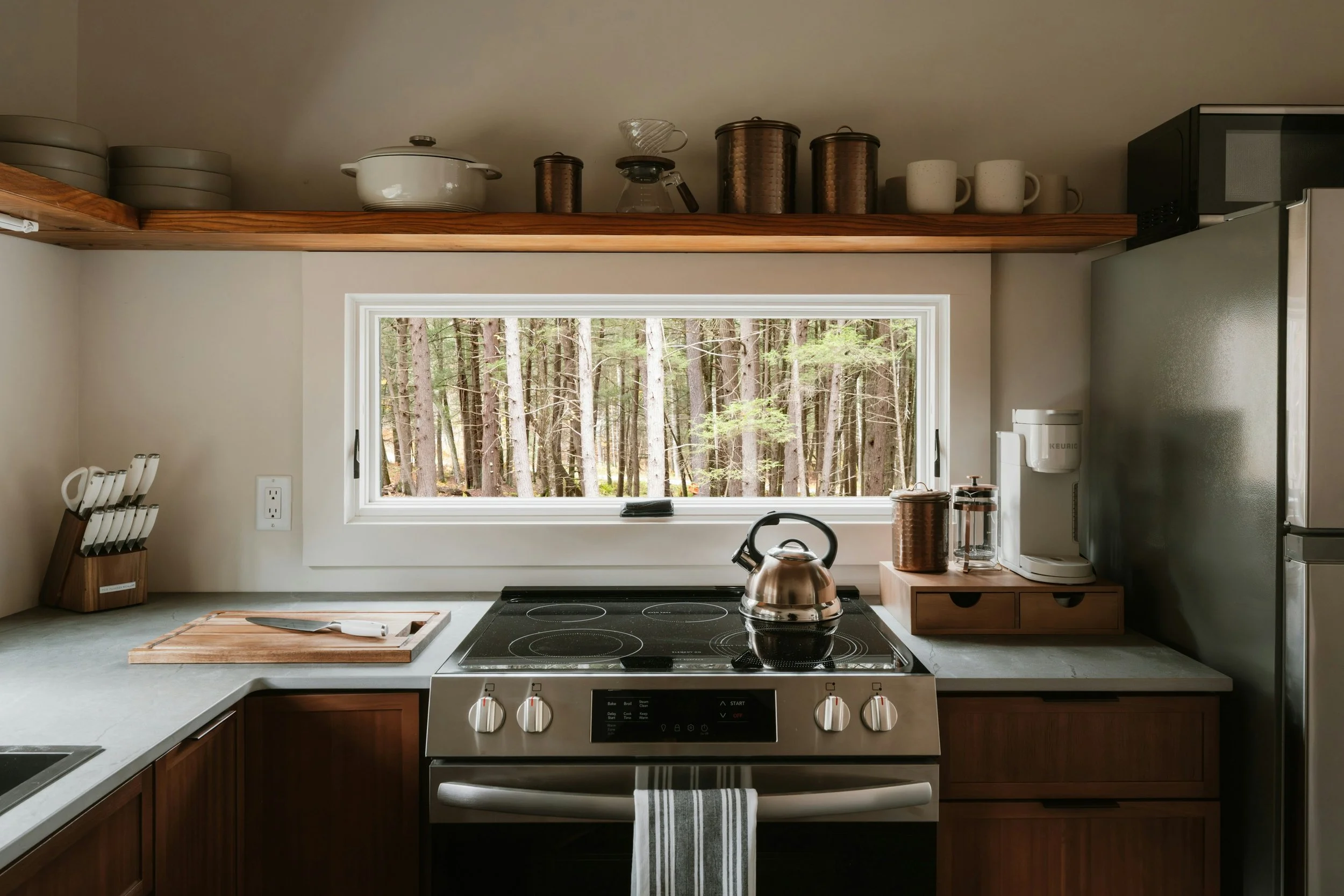 kitchen scene with knife and teapot on stove