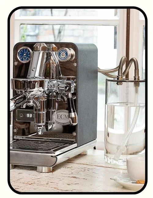 ECM Puristika espresso machine with glass water reservoir and stainless steel tubing