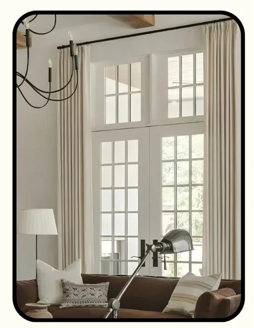 Sleepout non-toxic blackout curtains hung in a sunlit living room